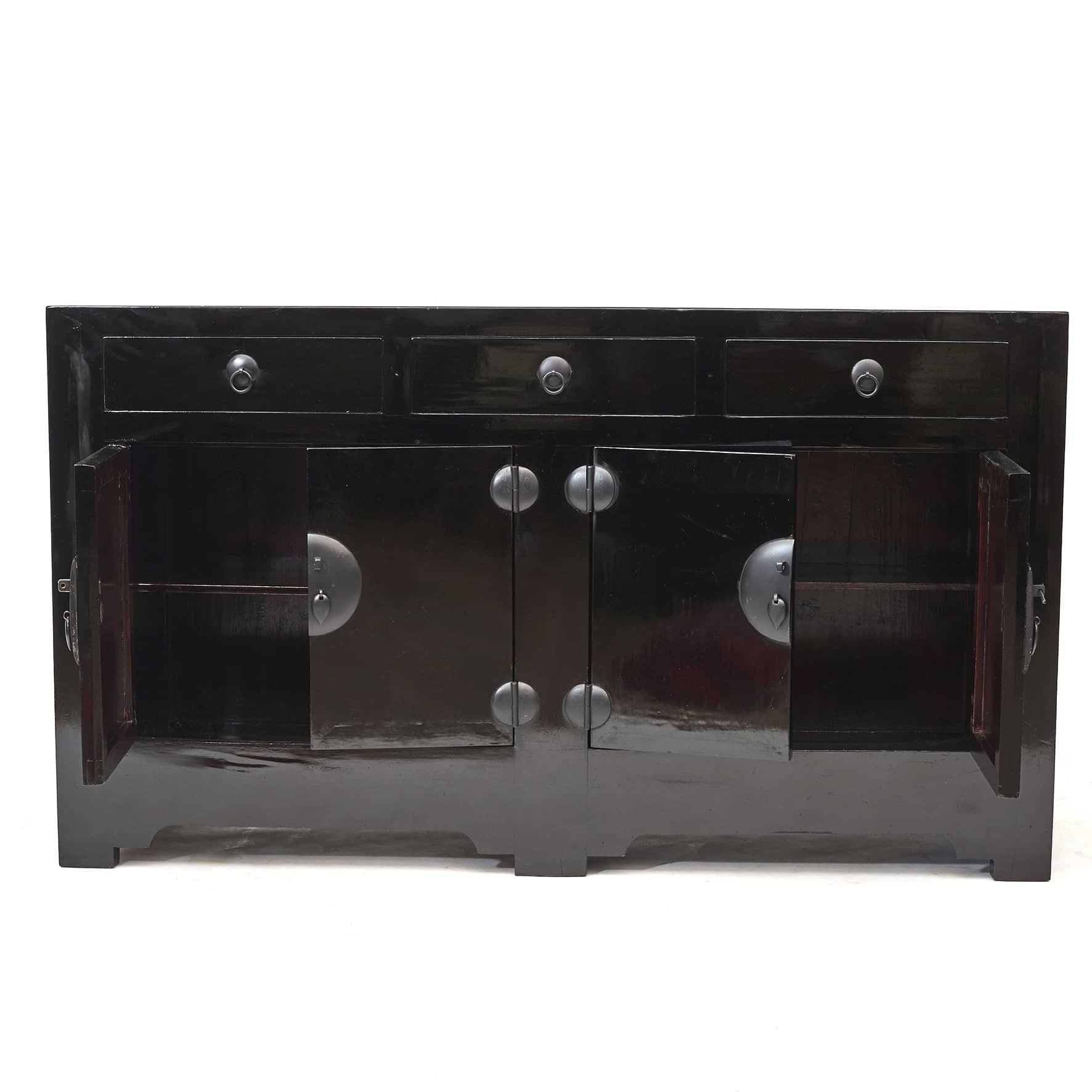 Black lacquer sideboard cabinet from Tianjin.
Under the top are 3 large drawers and a main section that consists of 2 pairs of doors. Drawers and cabinet doors have black patinated metal fittings and pull handles.
Timeless design clean lines and