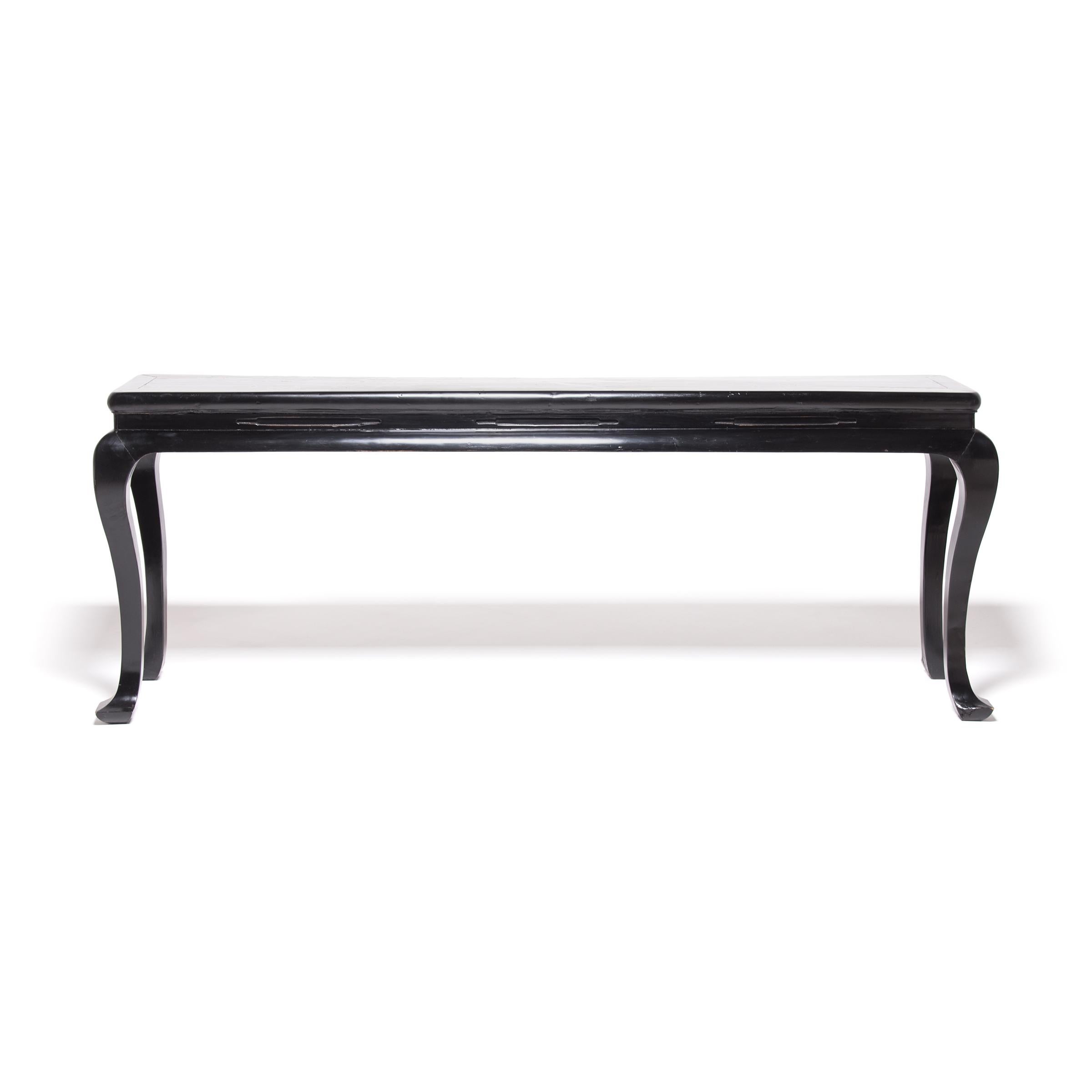 With deceptively simple design, this narrow console table would have been favored by a Chinese scholar for its well-executed curves, gracefully arched like the sweep of a calligraphy brushstroke. Conforming to the minimal aesthetic of Ming-dynasty