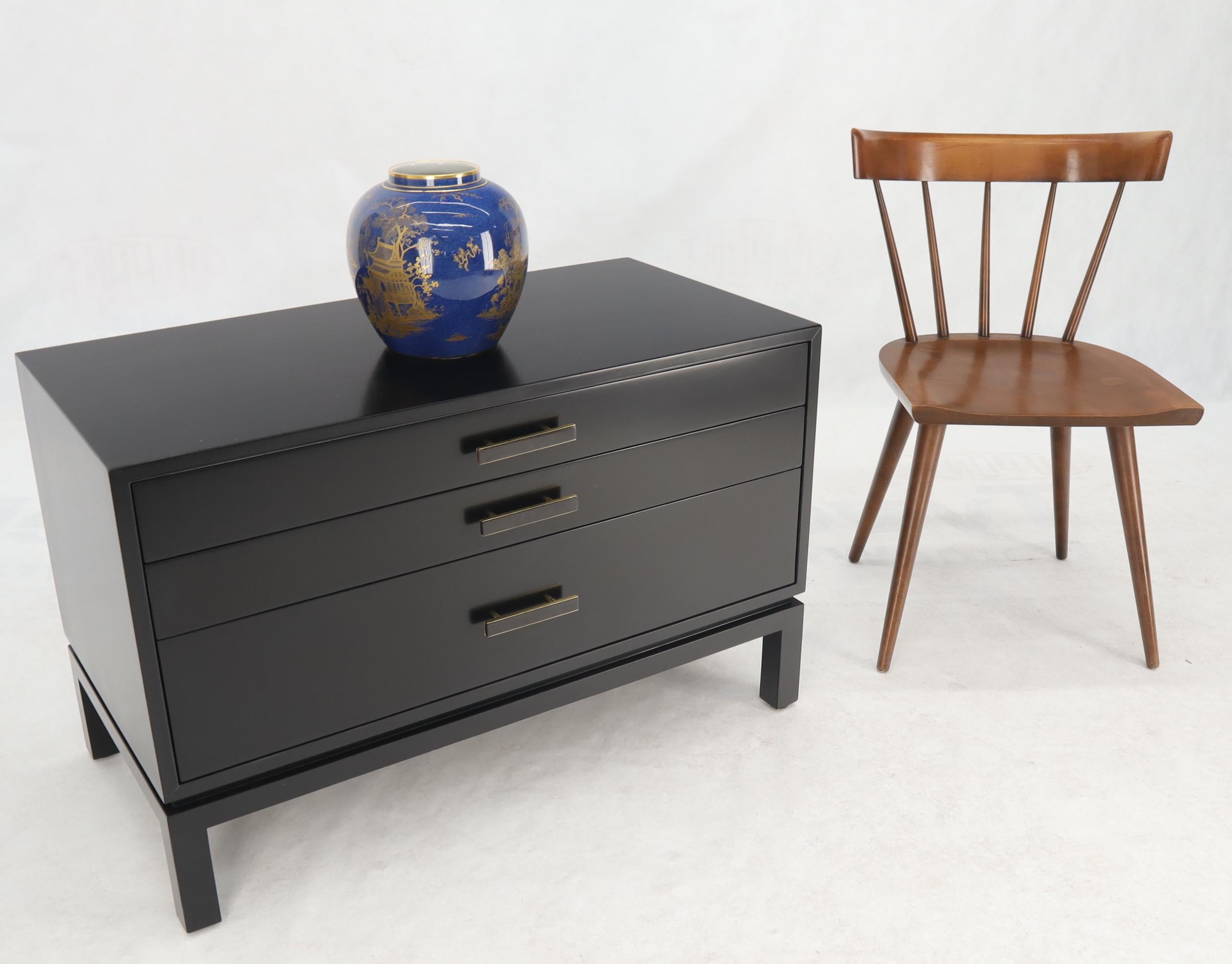 Mid-Century Modern ebonized mahogany three-drawer bachelor chest or extra wide large nightstand end table cabinet.
