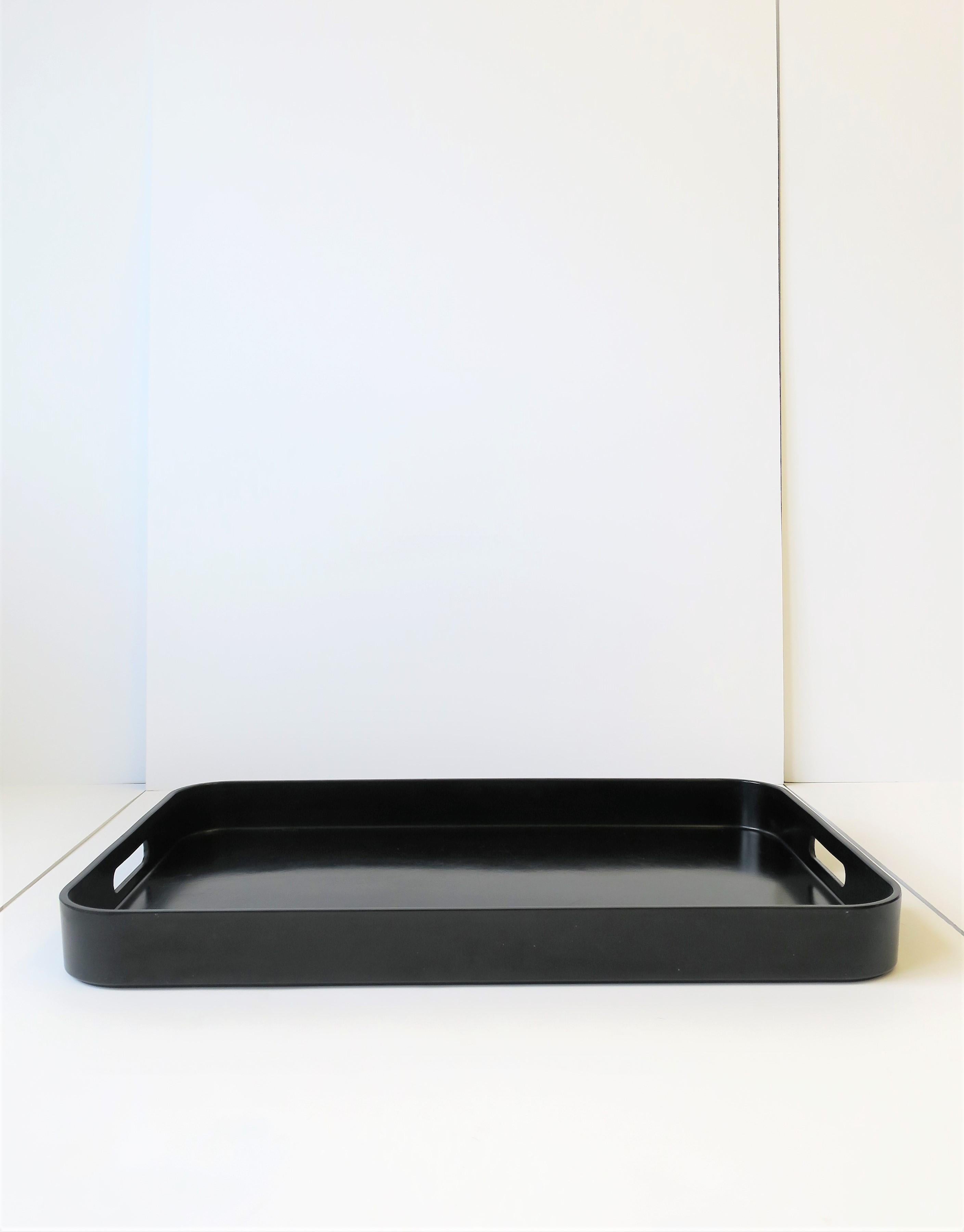 A beautiful modern style/Postmodern period black lacquer style tray, circa late 20th century. Tray has rounded corners and cut-out handles. 

Tray is a nice size measuring: 2