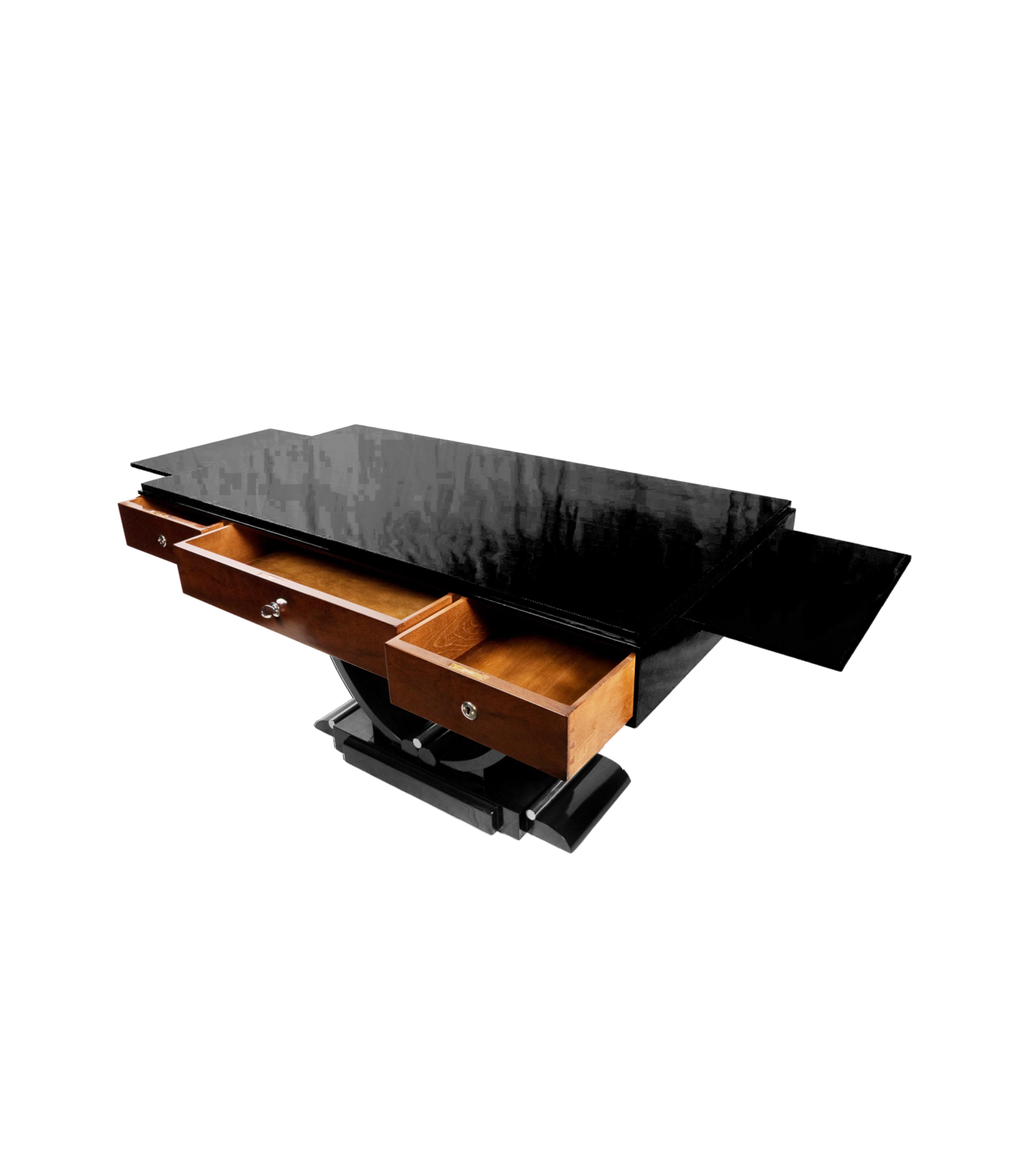 An impactful Black Lacquer Art Deco writing desk with walnut and chromed cast iron detailed base with three large drawers and side extensive platforms. 

Ideal for a design oriented space. 
