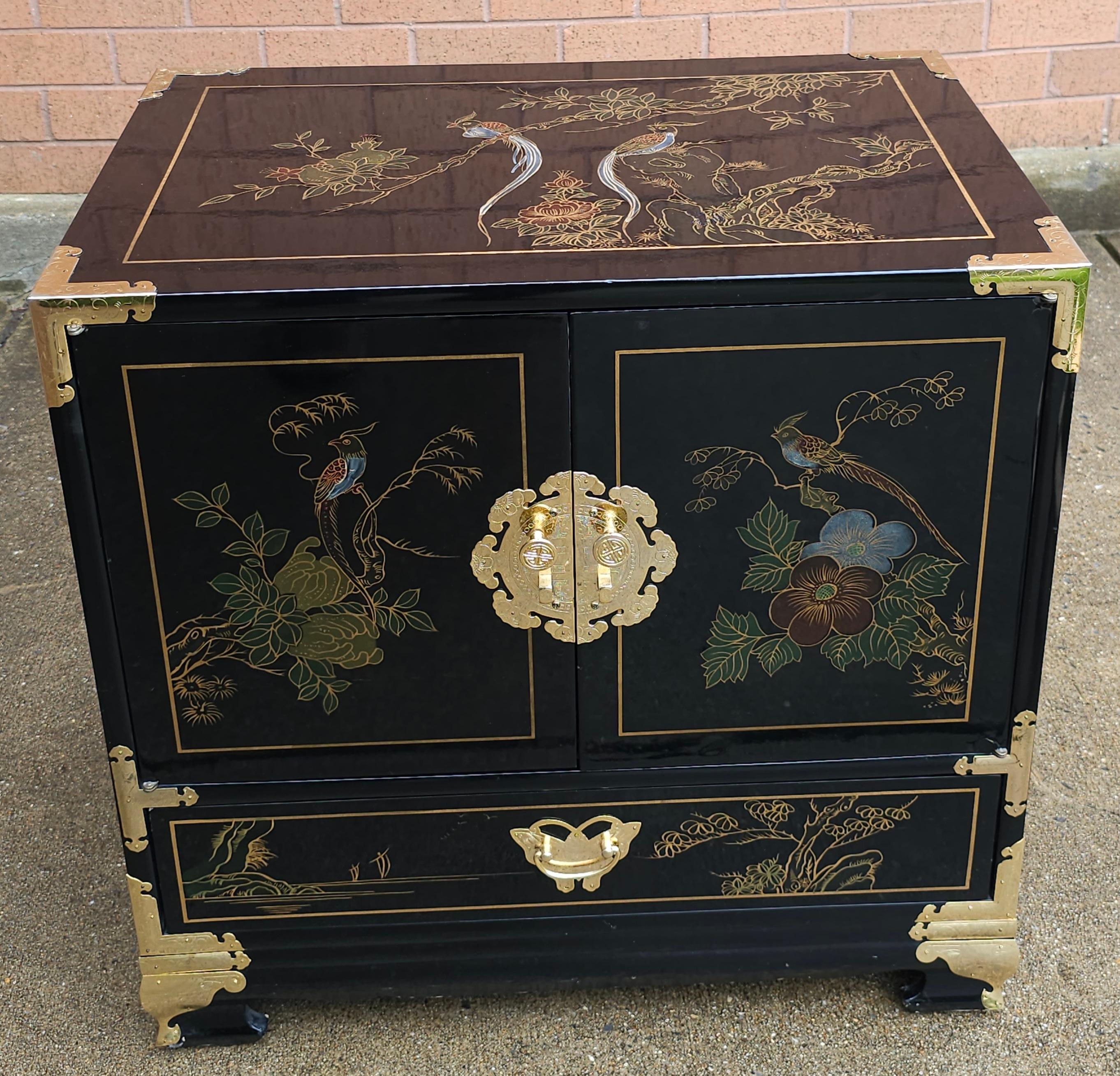 A beautiful Black Lacquered and Brass Mounted Chinoiserie Decorated Side Cabinet in great vintage condition. Measures 24