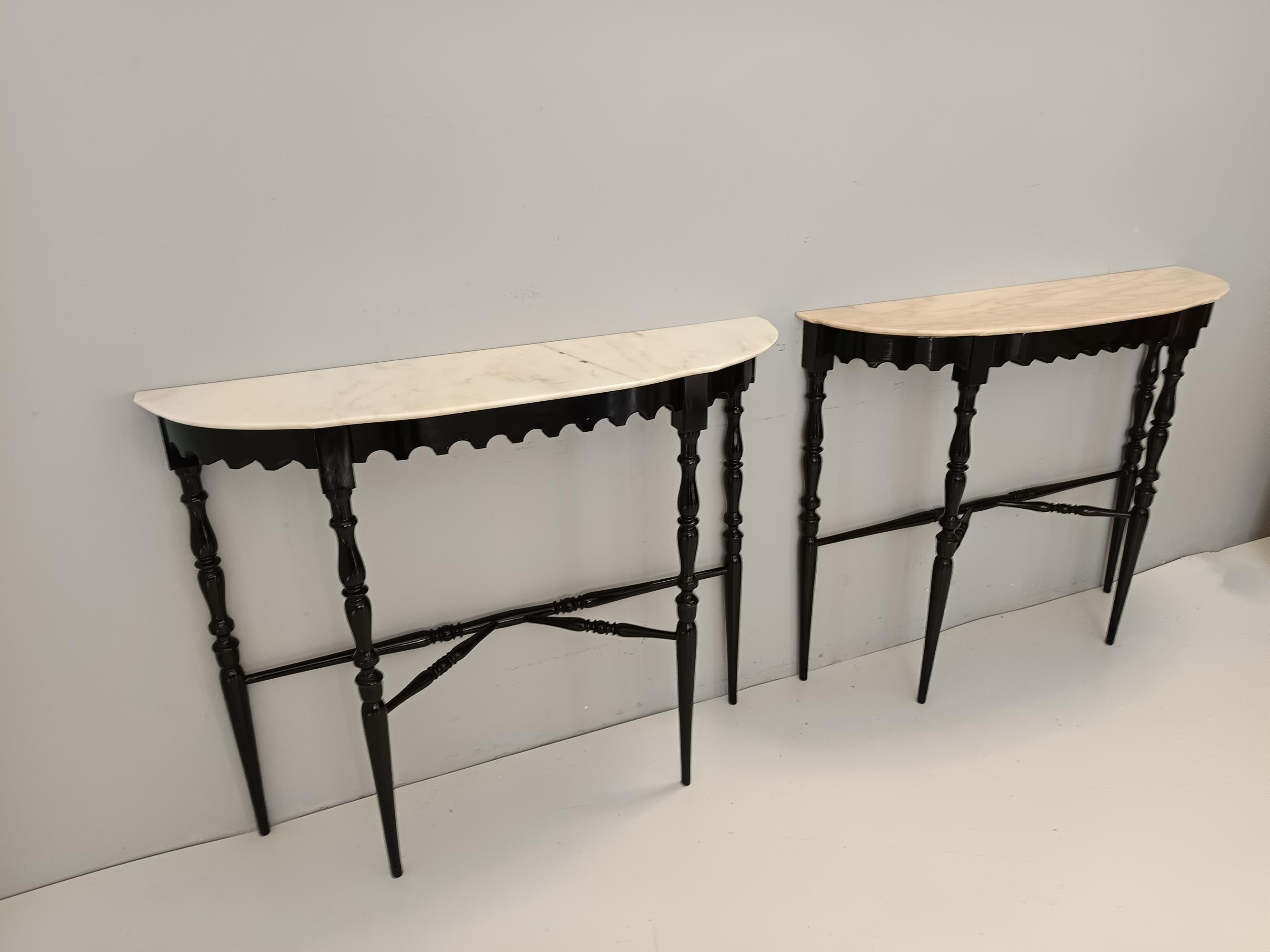 Made in Italy, 1950s.
This console table features a demilune Portuguese pink marble top and a black lacquered beech frame. 
It is a vintage item, therefore it might show slight traces of use, but it can be considered as in excellent original