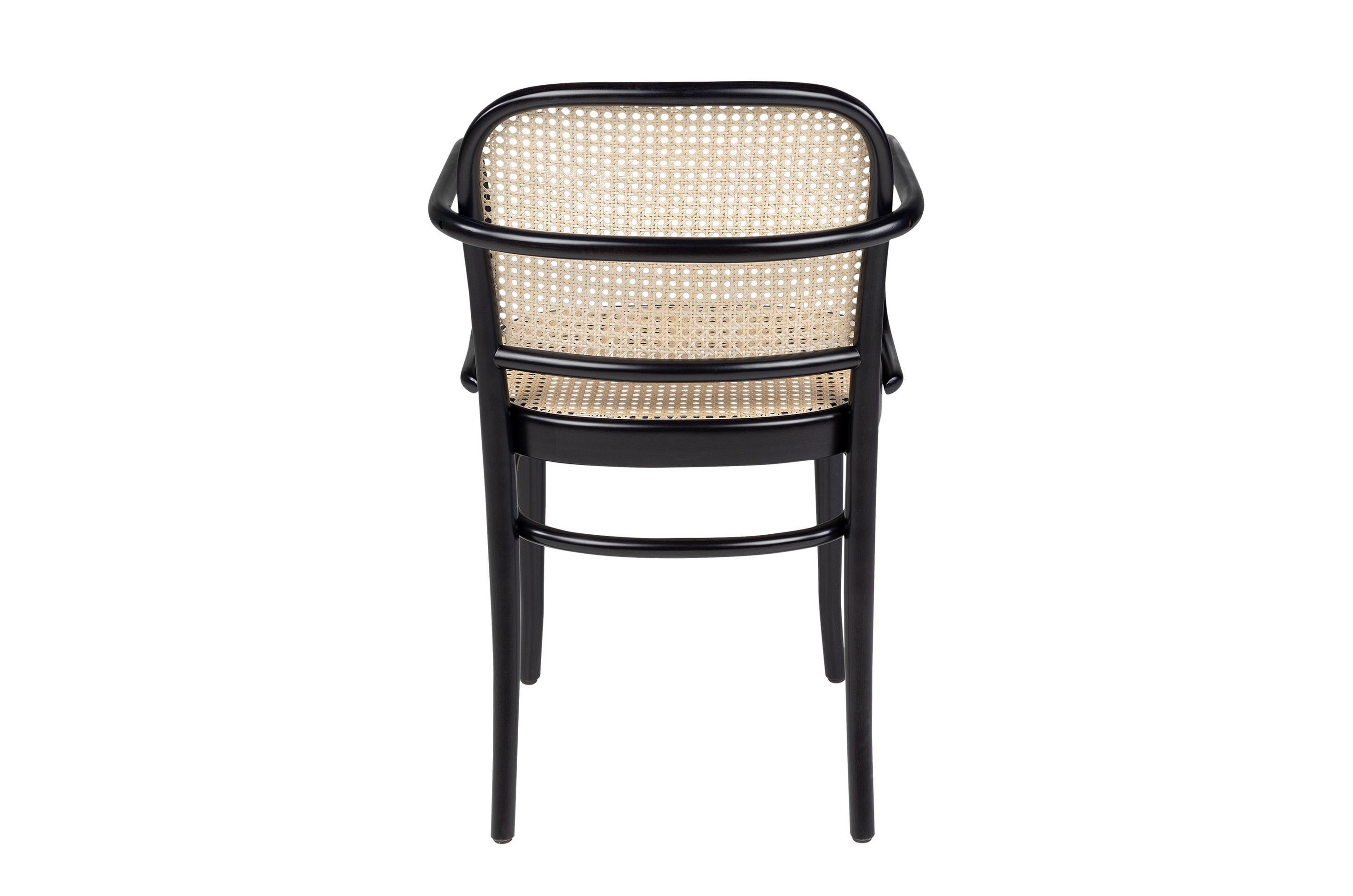 Bistro design style black lacquered curved beech wooden and natural rattan wicker cane armchair.