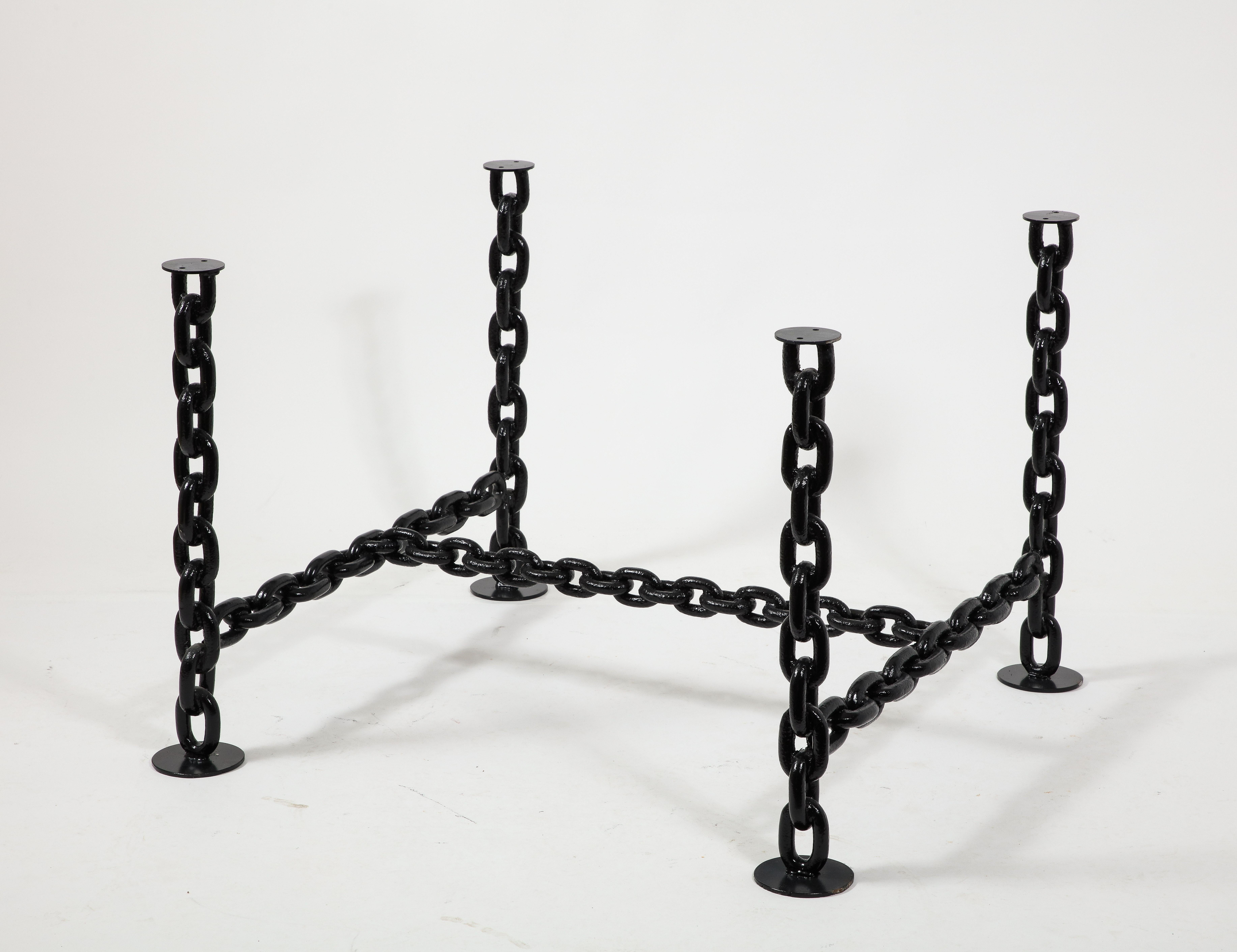 Unique brutalist massive dining or center table structure made of welded marine chains lacquered in black enamel.
In the style of Franz West.
France 1970's.