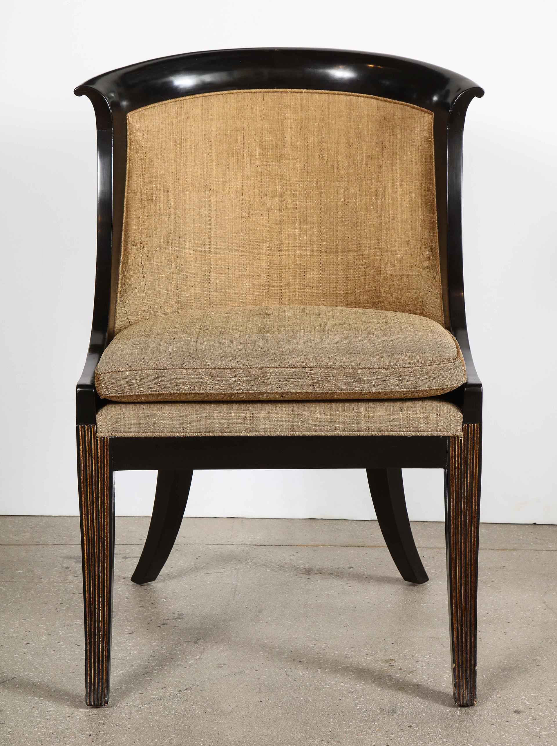 French Empire style black lacquer chair

The scroll topped rounded back on saber legs.