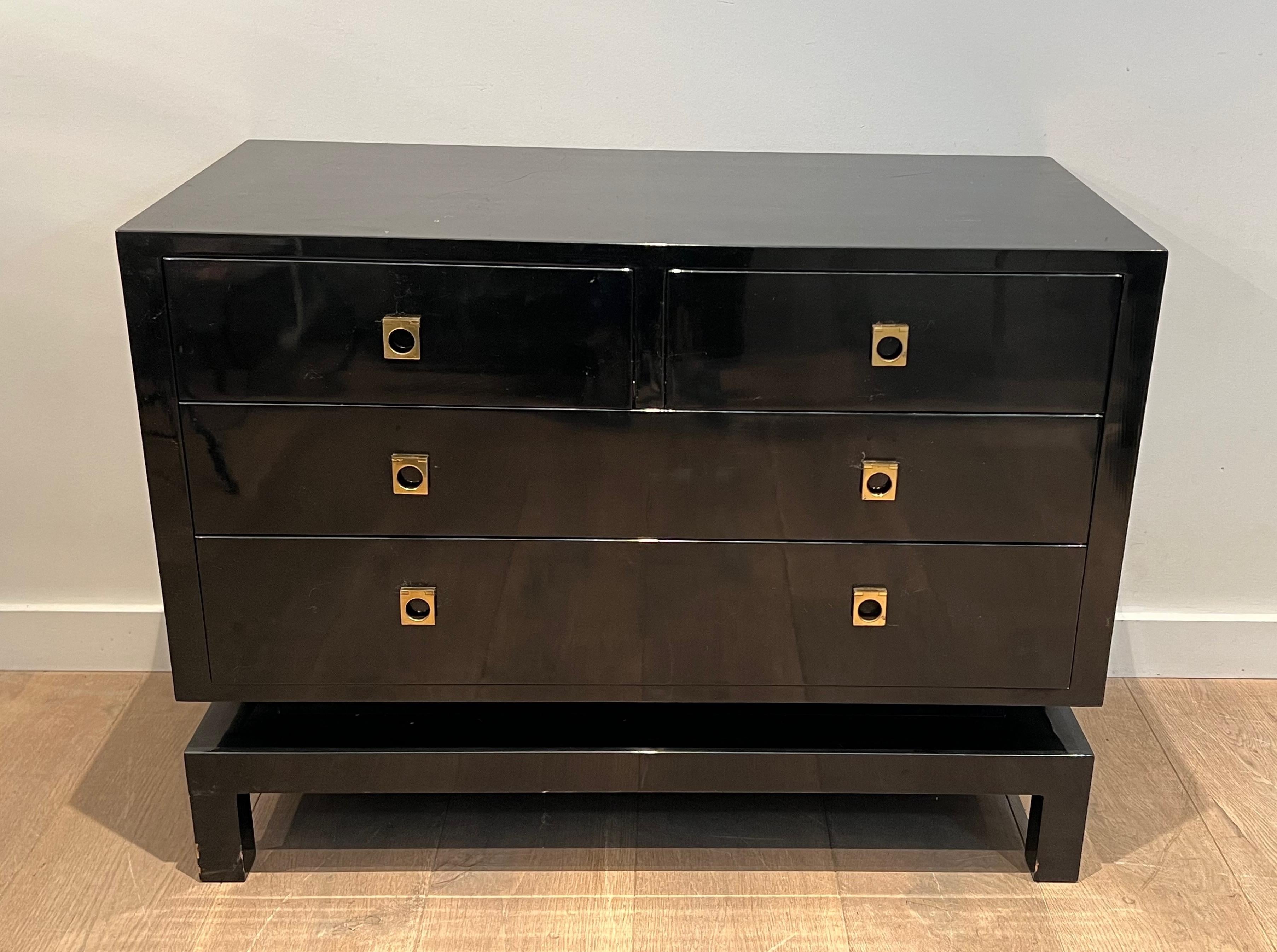 This chest of drawers is made of black lacquered wood with bronze handles. This is a French work by famous designer Guy Lefèvre for Maison Jansen. circa 1970.