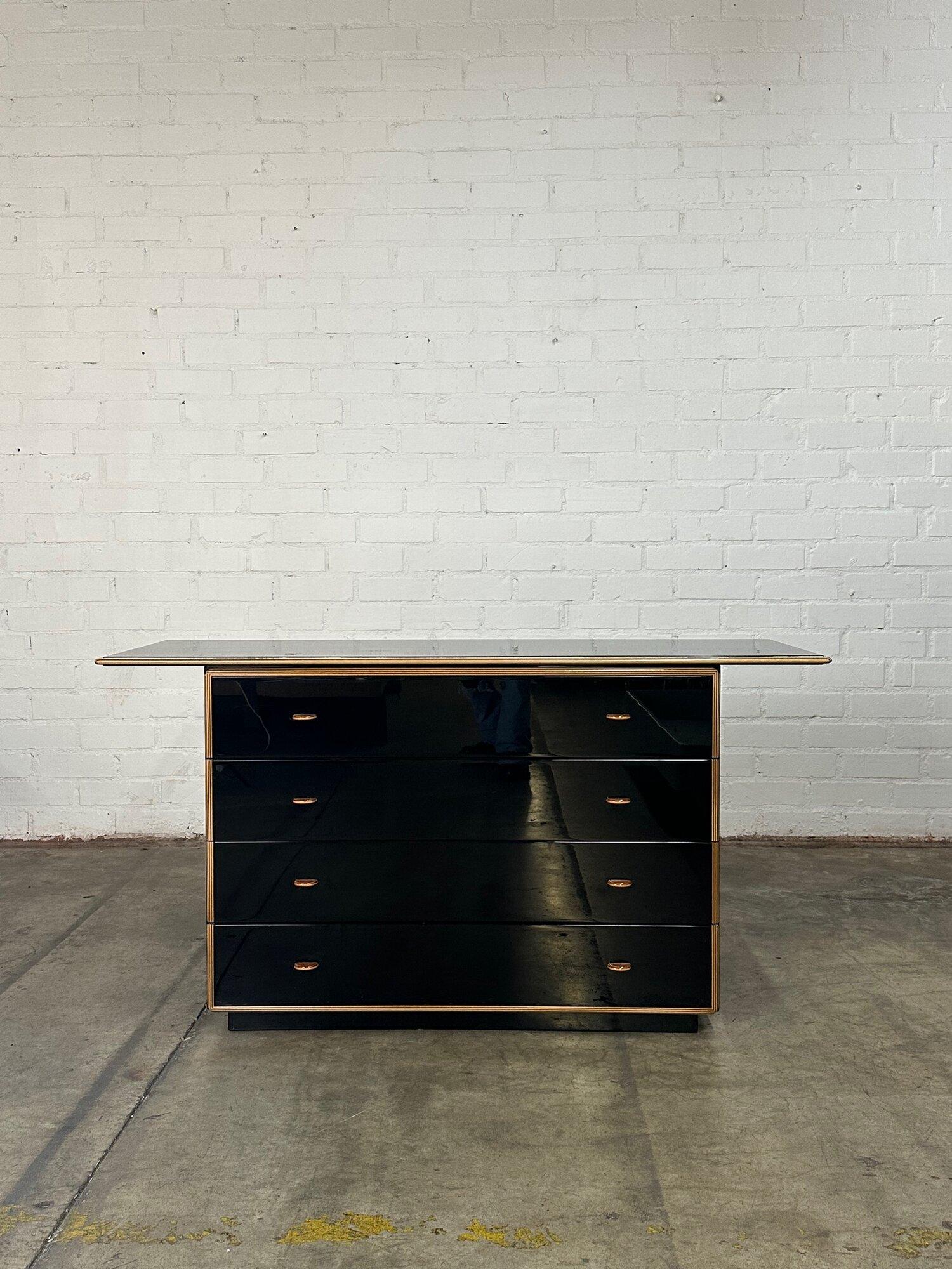 W59 D20 H31

Black Lacquered Chest of Drawers by Roche Bobois.

Item has some minimal surface scratches. Item is structurally sound and sturdy.