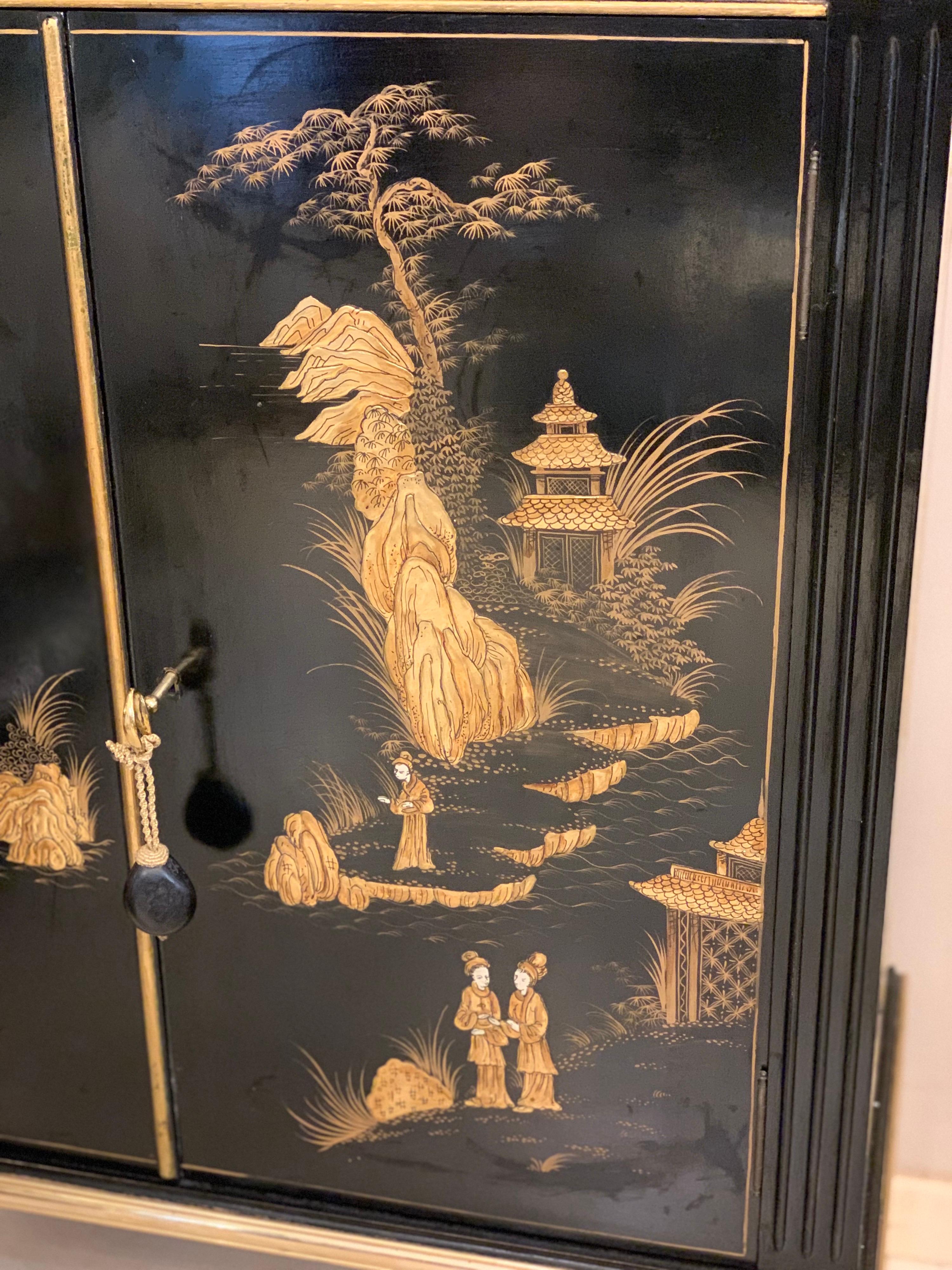 Chinoiserie Black Lacquered Chinese Cabinet with Gilt Hand Painted Motifs, Early 1900