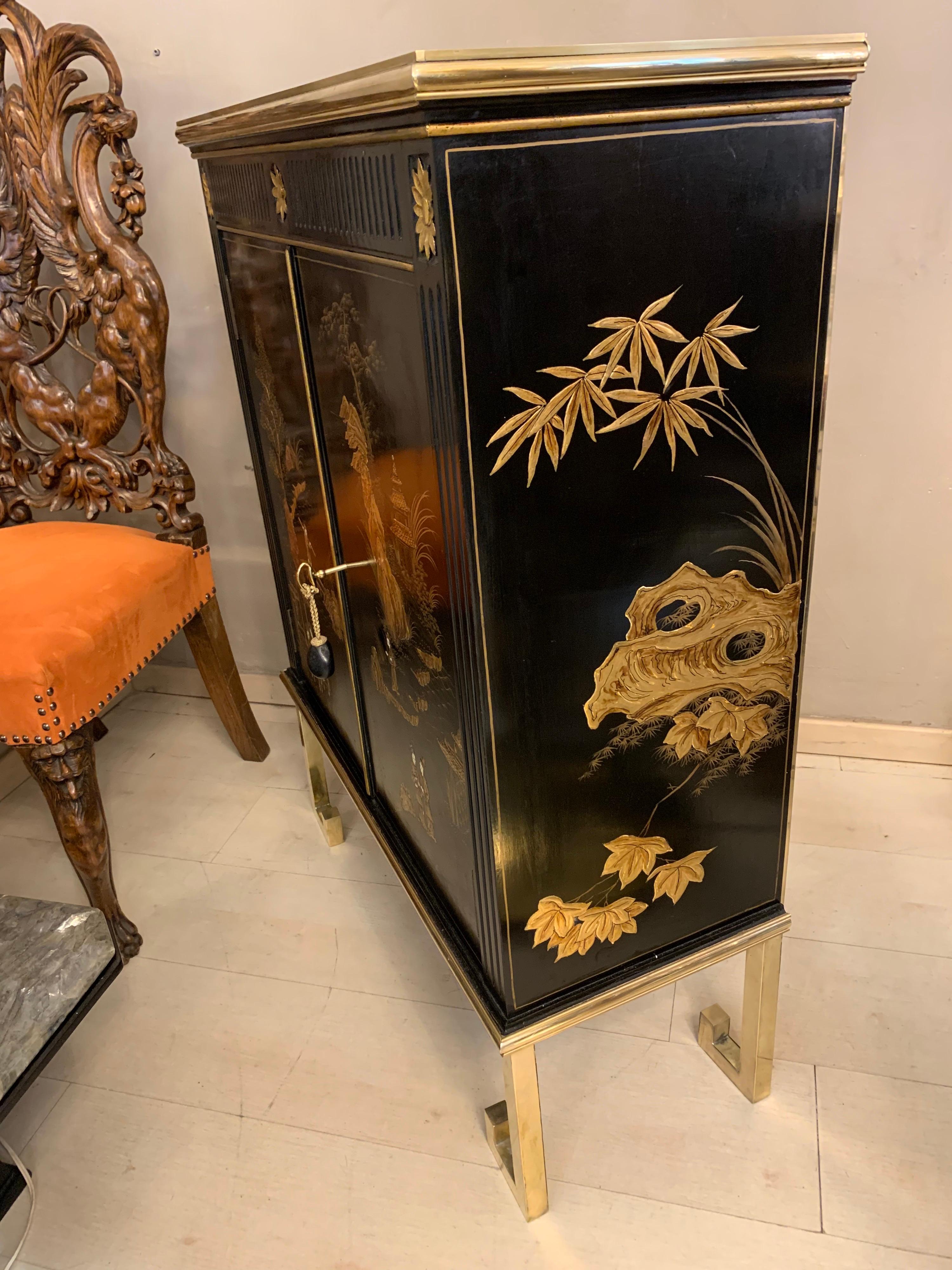 20th Century Black Lacquered Chinese Cabinet with Gilt Hand Painted Motifs, Early 1900