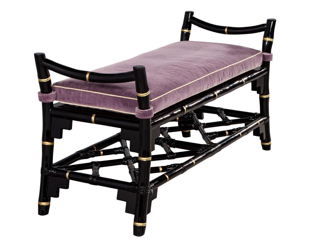 Black Lacquered Chinoiserie Inspired bench with hand painted gold accents. American, 1980's. Featuring violet velvet with soft gold toned piping. Wood finished in a glossy black lacquer with hand painted gold accents. Price includes complimentary
