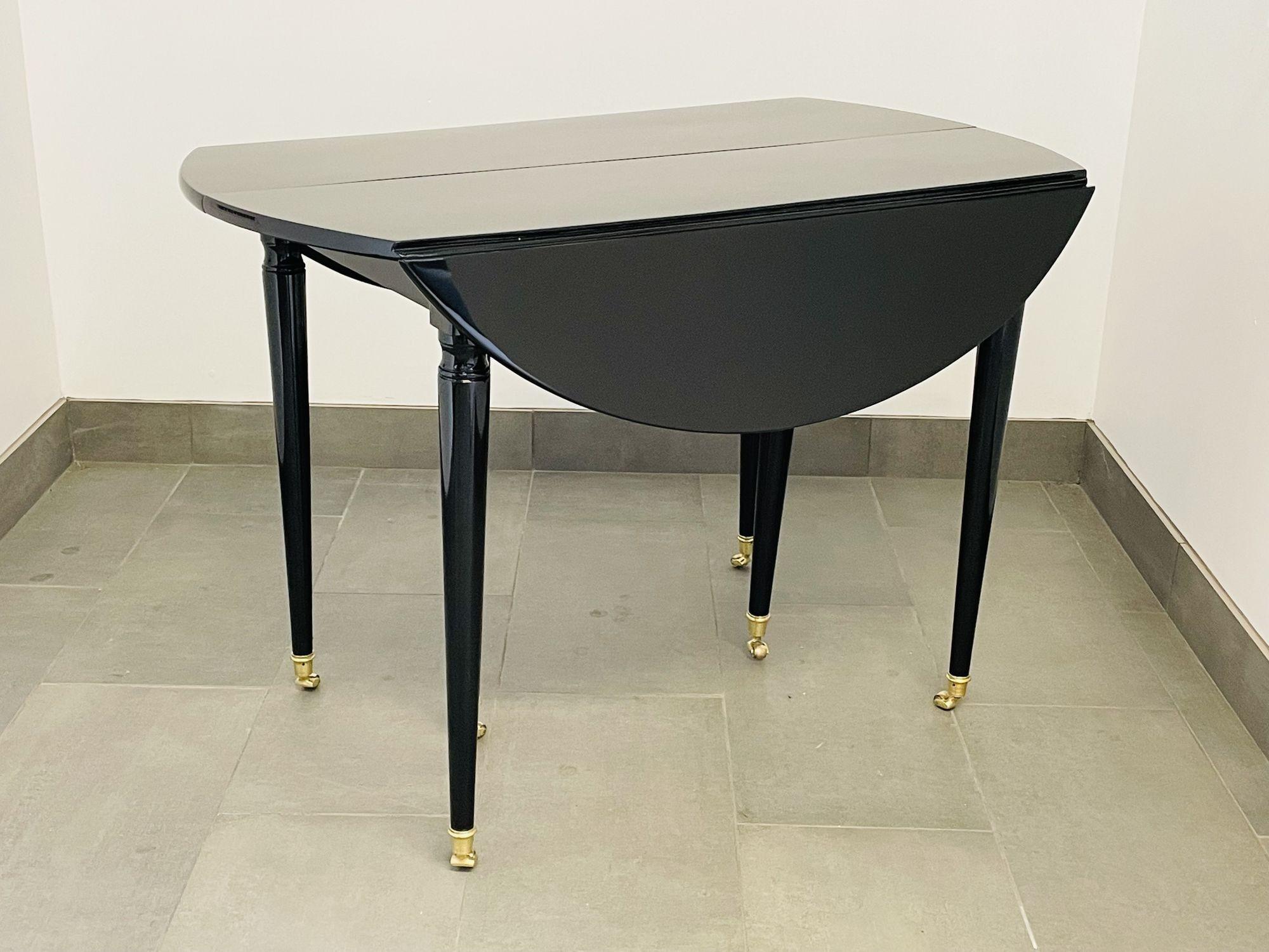 A Hollywood Regency Center, Dining Table. Louis XVI, Maison Jansen. Drop Leaf. Part of our extensive collection of over forty dining tables and chair sets as seen on this site, thus why we are referred to as the King of Dining rooms.
A sleek and
