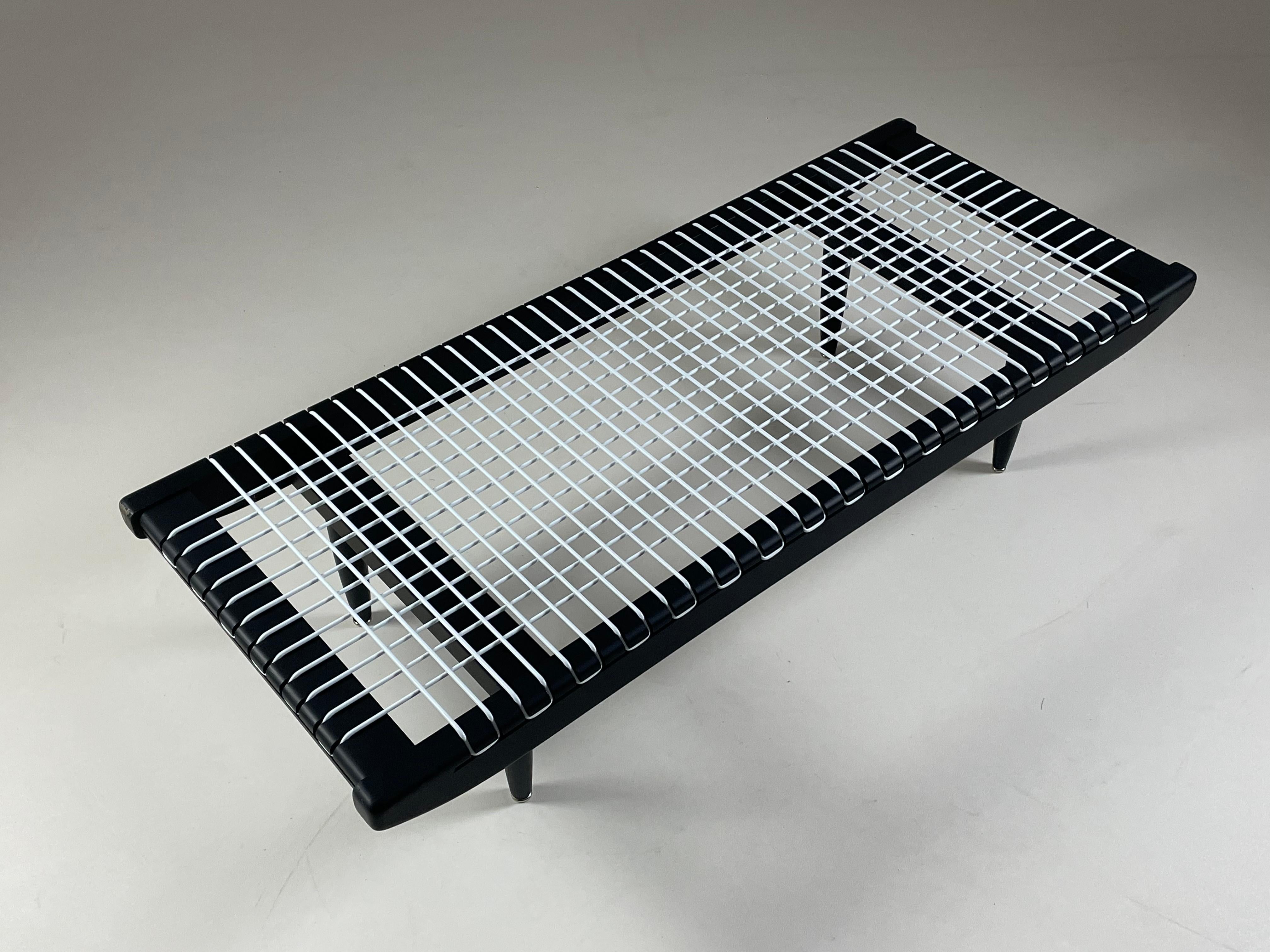 Coffee table by georges tigien from the 1960s. Structure in black lacquered beech and “prenas” plastic wire. Very good state of preservation. Possibility of placing a glass plate on top for a more functional use.