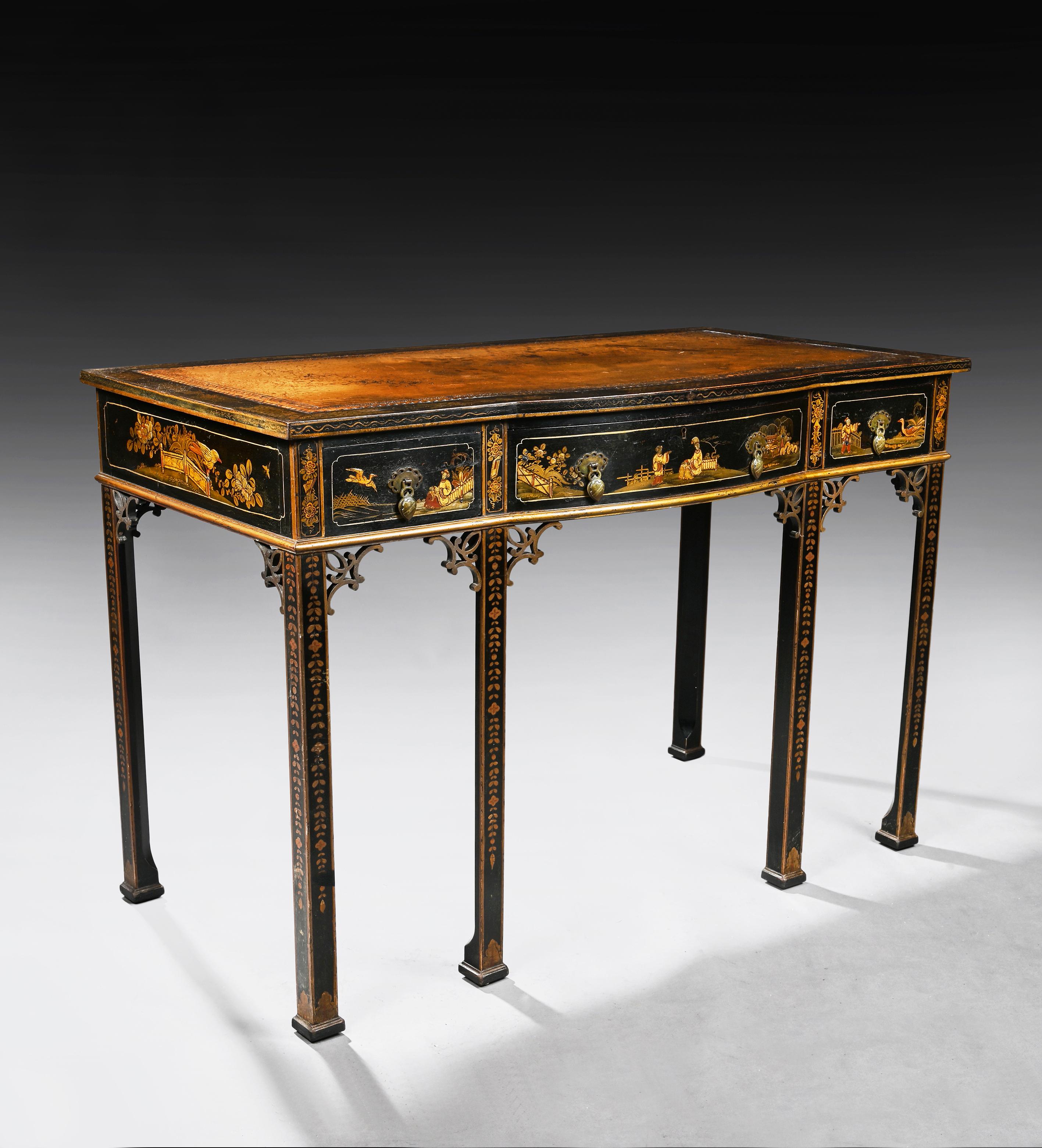 An elegant early 20 century black lacquered chinoiserie writing table with the original leather insert. 

England circa 1910-1920.

Of an elegant and unusual form this antique writing table is decorated with black lacquer and chinoiserie having