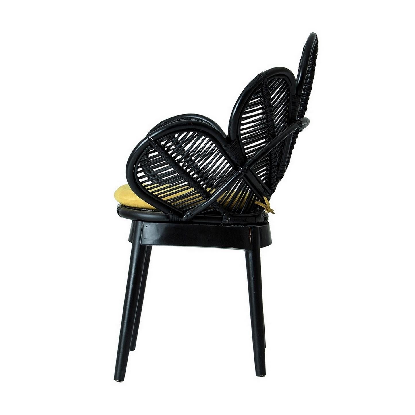 Gorgeous armchair: rattan flower petal shaped seat, on wooden feet. Perfect on your terrace, in your veranda, around the swimming pool or the dining table. Poetic, elegant, aerial.