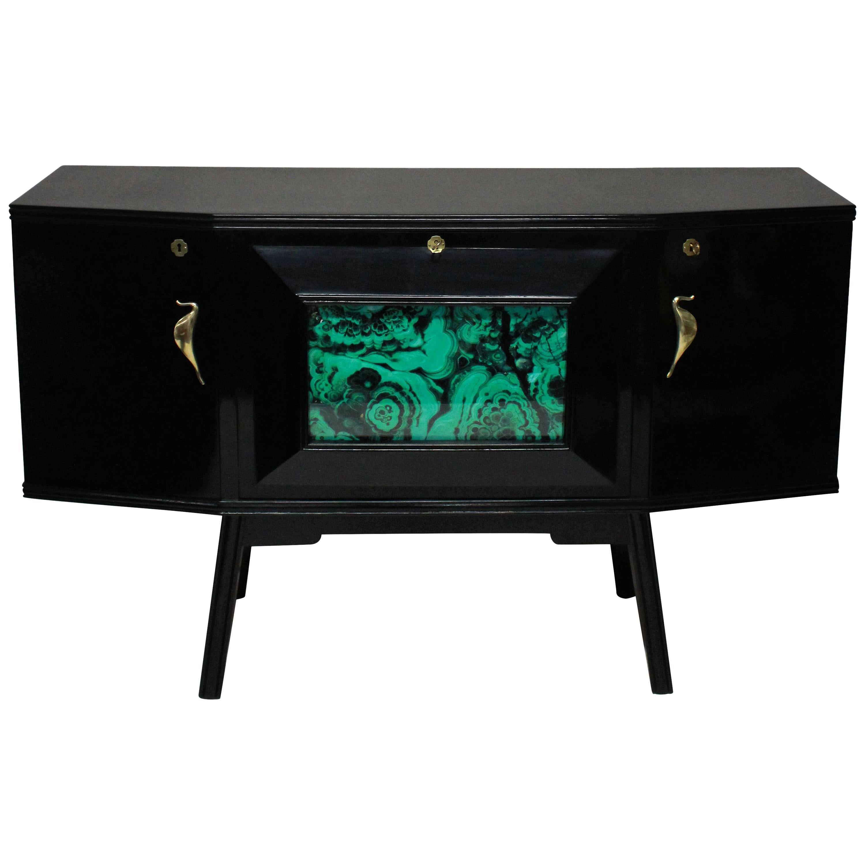 Lacquered Italian bar credenza stylish Italian bar credenza of interesting angular design in black lacquer with sepele wood interior, with brass hardware and a faux malachite central panel and mirrored interior.

 