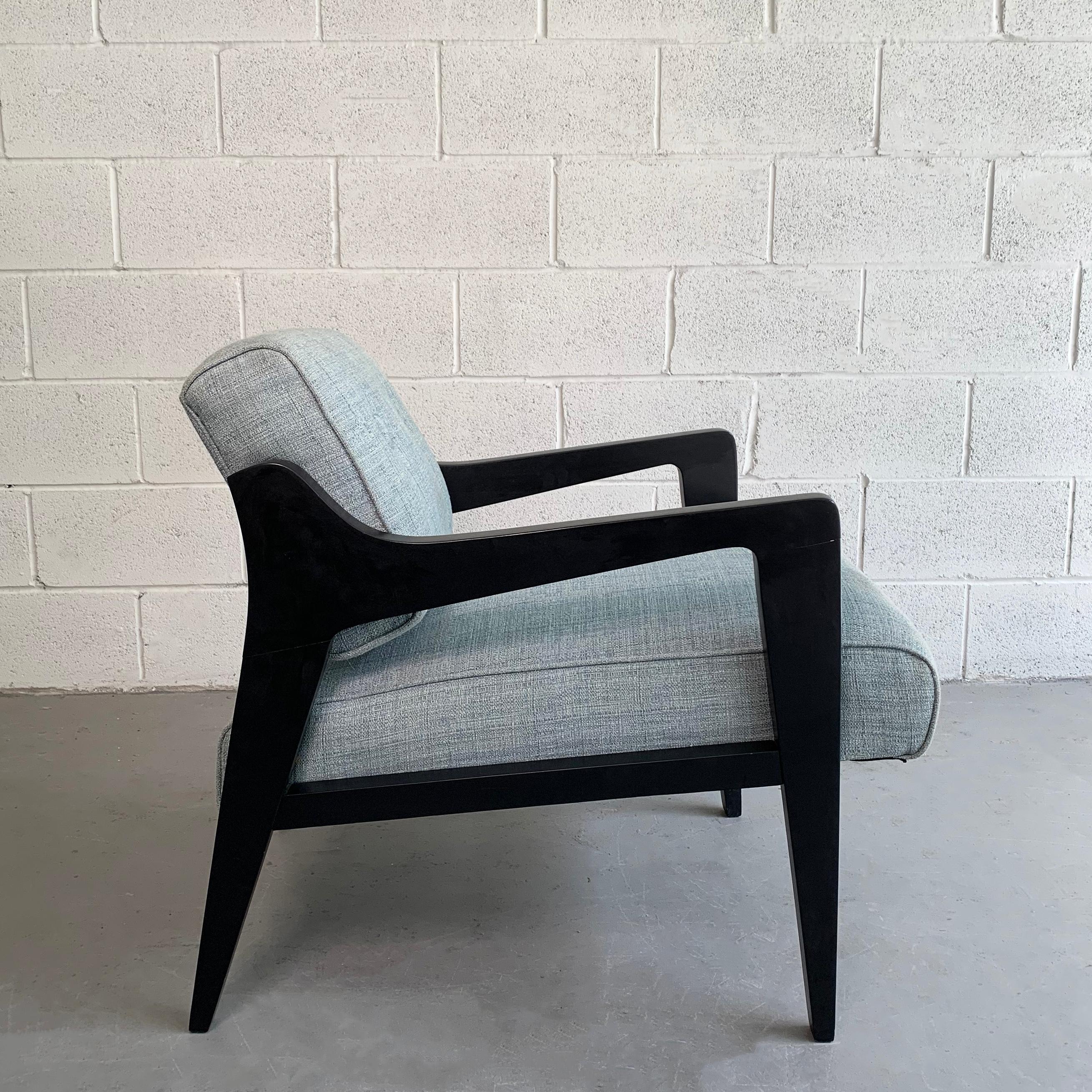 Mid-Century Modern, low profile, lounge chair by Edward Wormley for Dunbar features a stylized, black lacquered maple frame is newly upholstered in contrasting light blue, woven, cotton linen blend.