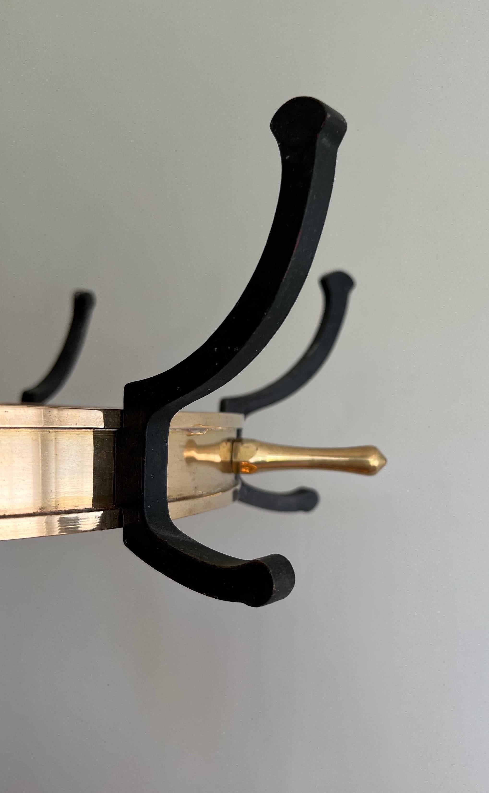 20th Century Black Lacquered Metal and Brass Coat Hanger by Jacques Adnet