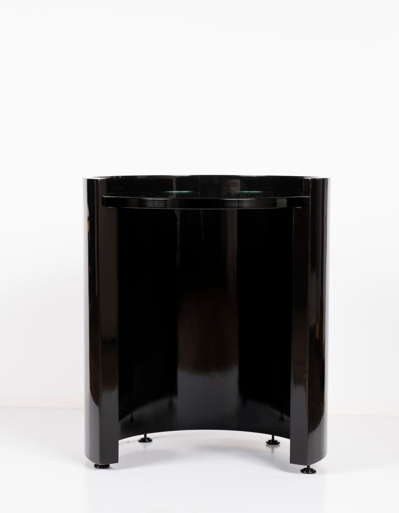 A contemporary and modern bold black lacquered geometric table with 3/4