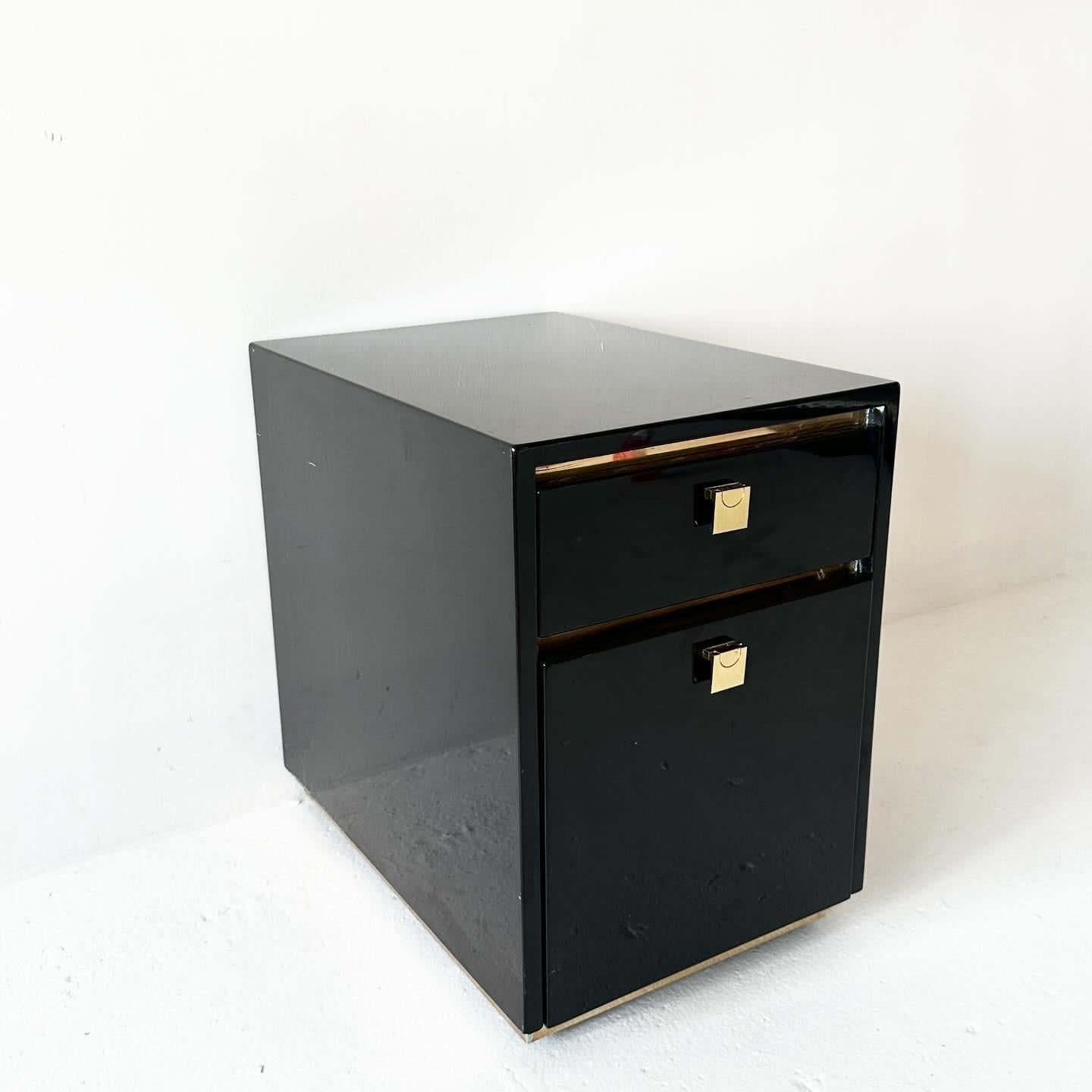 black lacquered 1980s rolling filing cabinet with top drawer and polished brass accents.