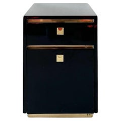 black lacquered rolling filing cabinet with brass accents