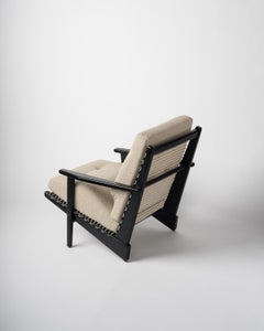 Fauteuil "Kagourou" en teck laqué noir de George Tigien, France, années 1950