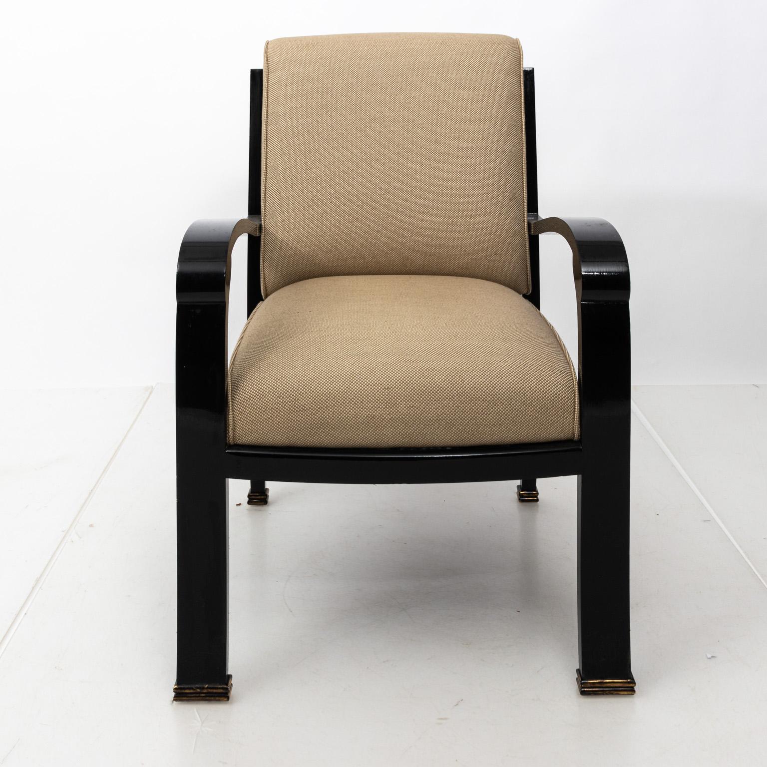 Black lacquered desk armchair with upholstered seat. Please note of wear consistent with age including minor chips, scratches, and finish loss to wood.