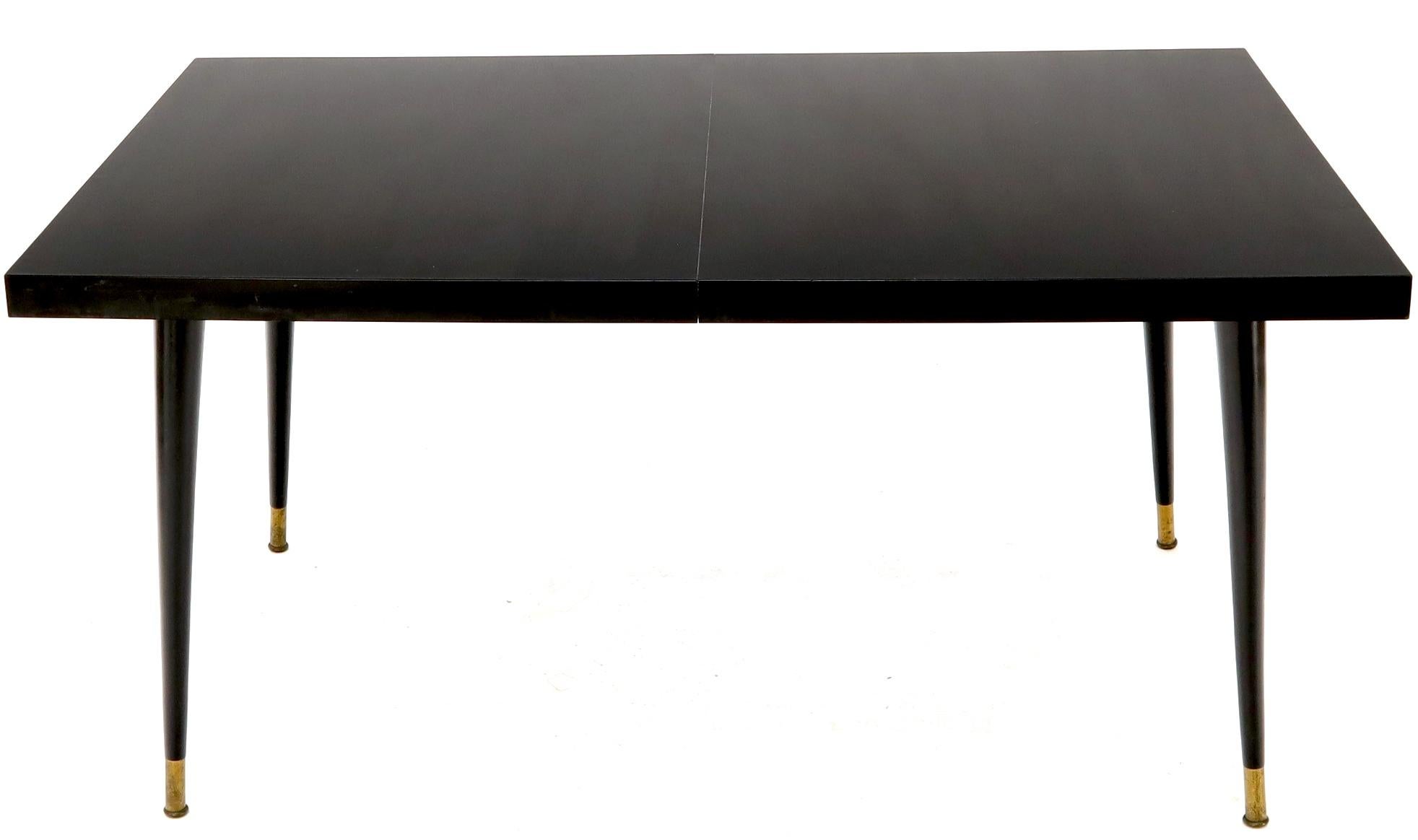 Mid-Century Modern Black Laminate Tapered Dowel Legs Dining Table with Extension Board For Sale