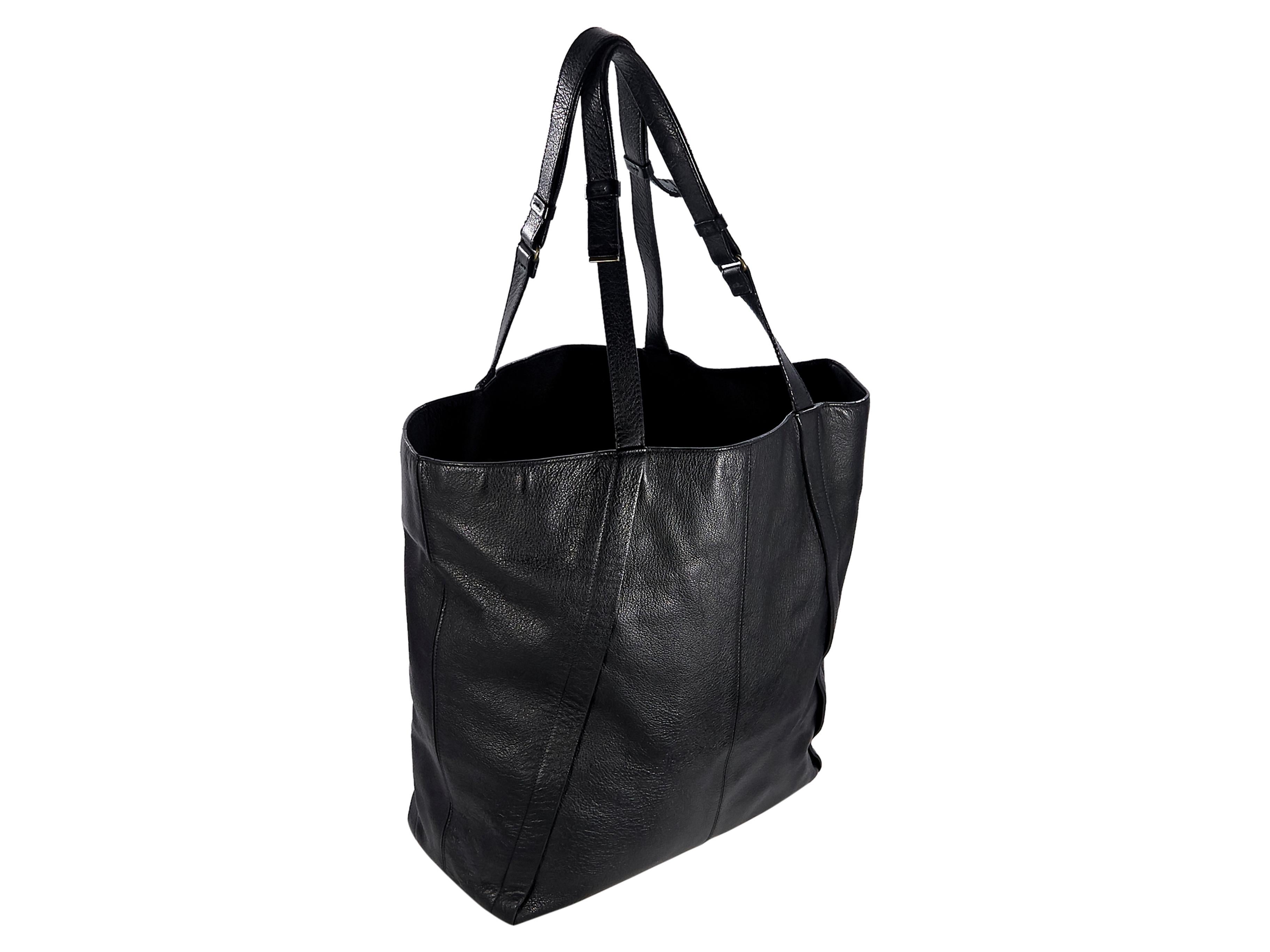 Product details:  Black leather Miss Sartorial tote bag by Lanvin.  Dual shoulder straps.  Open top.  Lined interior with inner zip and slide pockets.  Goldtone hardware.  16.75