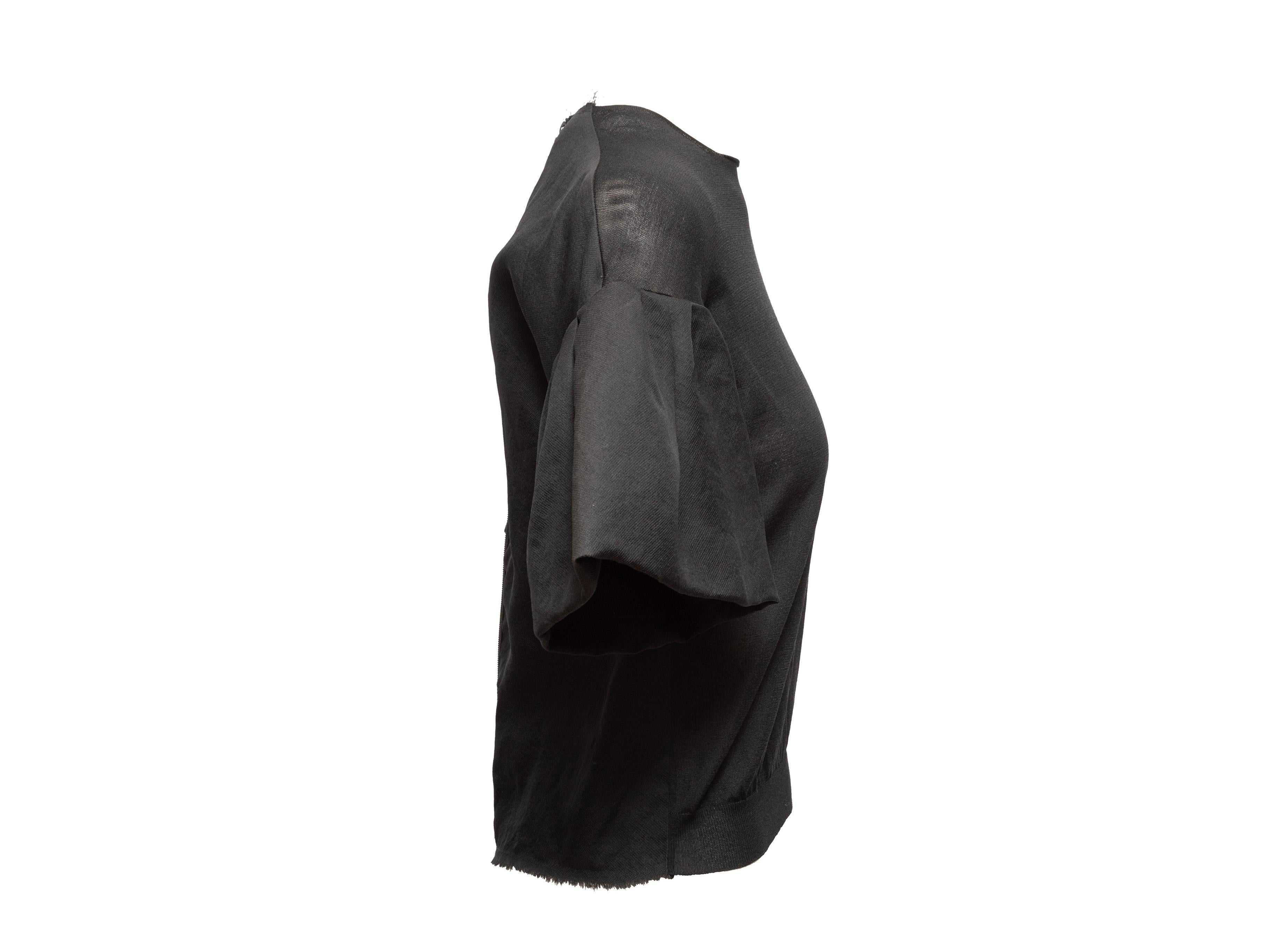 Product Details: Black silk top by Lanvin. V-neck. Short ruffle-trimmed sleeves. Zip closure at center back. 34