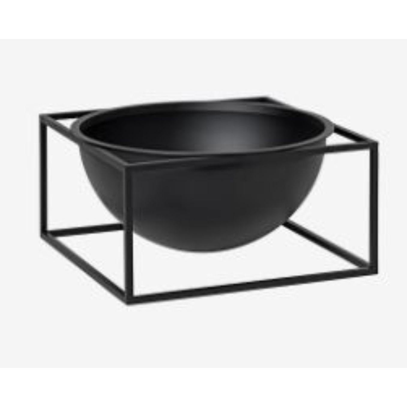 Black large centerpiece Kubus bowl by Lassen
Dimensions: D 23 x W 23 x H 11.50 cm 
Materials: metal 
Weight: 3 Kg

The dictionary definition is “an object occupying a central, especially an adornment in the center of a table” and the Kubus