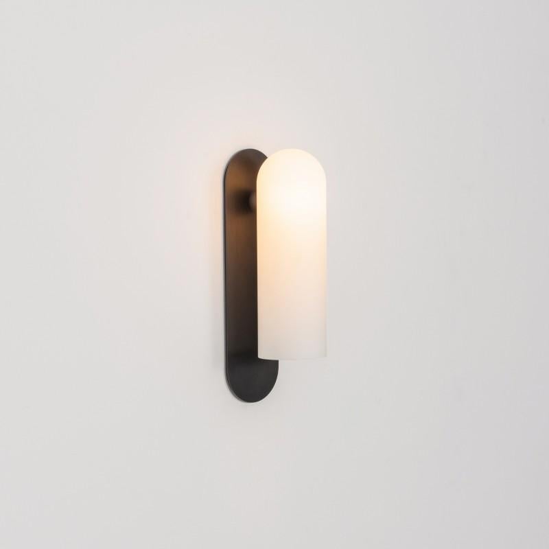 Odyssey LG Black Wall Sconce by Schwung
Dimensions: W 10.5 x D 14 x H 38 cm
Materials: Black gunmetal, frosted glass

Finishes available: Black gunmetal, polished nickel, brass

Schwung is a German word, and loosely defined, means energy or