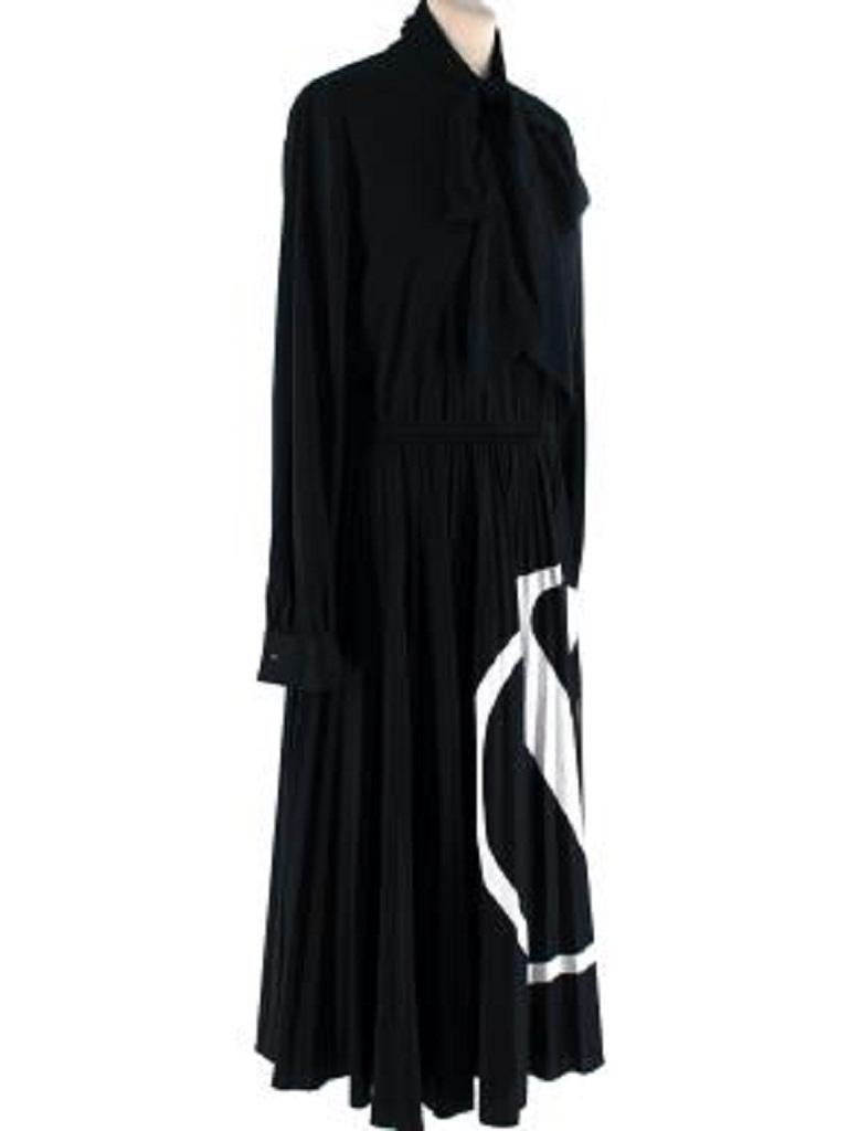 Valentino Black Lavaliere Neck V-Logo Long Dress
 

 - Fluid, long black dress, with elegant lavaliere neckline, gathered waistline, and full long skirt
 - Button finished long sleeves
 - White V-Logo printed on the skirt
 

 Materials 
 100%