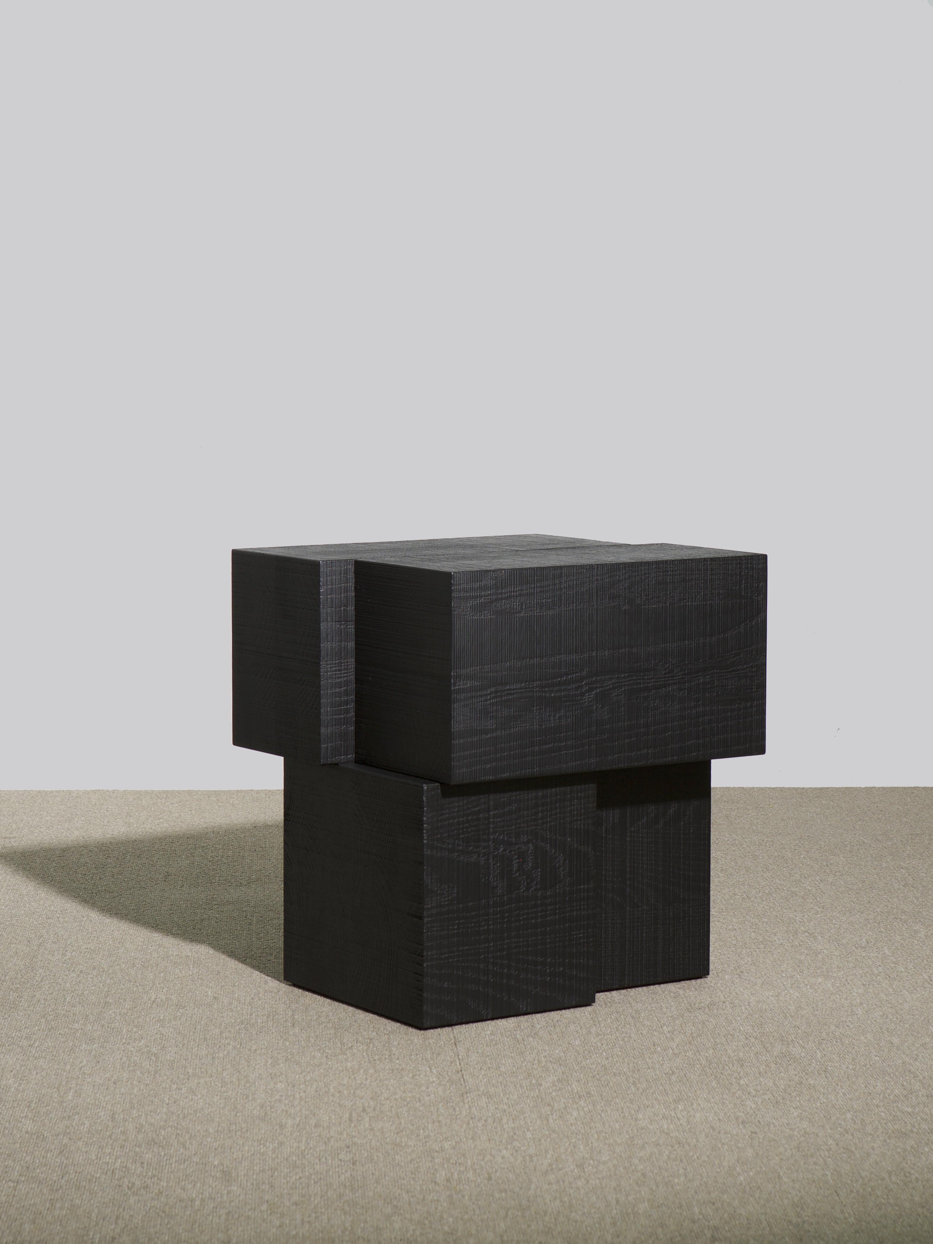 Black layered oak wood stool by Hyungshin Hwang.
Dimensions: D 36 x W 30 x H 45 cm.
Materials: ebonized red oak.

Layered Series is the main theme and concept of work of Hwang, who continues his experiment which is based on architectural