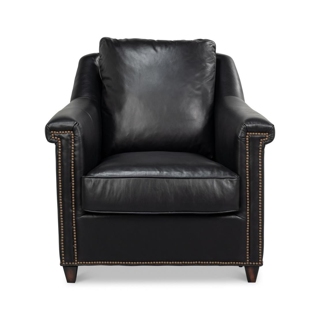 Upholstered in rich Onyx Black leather, this chair is designed to make a statement. Its contrasting oak wood frame adds a touch of classic charm, while the nailhead trim along the edges provides refined detailing and sophistication.

Ideal for