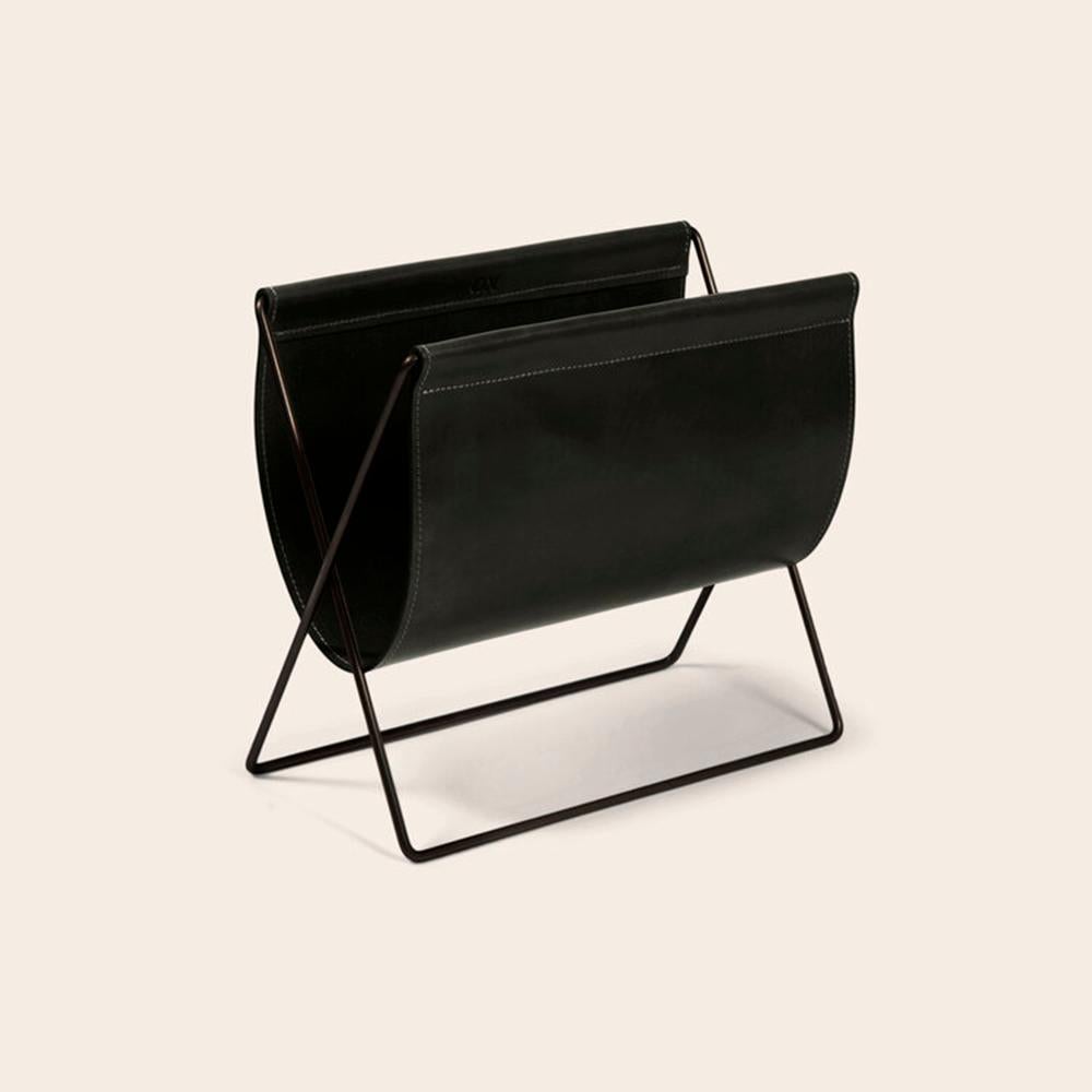 Black leather and black steel maggiz magazine rack by OxDenmarq
Dimensions: D 24 x W 47 x H 43 cm
Materials: Steel, Leather
Also Available: Different leather and frame colors available.

OX DENMARQ is a Danish design brand aspiring to make