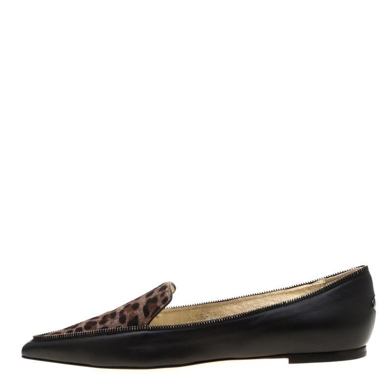 These pretty Jimmy Choo Paloma flats are super chic! They are crafted from black leather featuring contrasting leopard-printed pony hair panel on the vamps along with chain trims on the outlines that extend from the counters to the pointed toes.