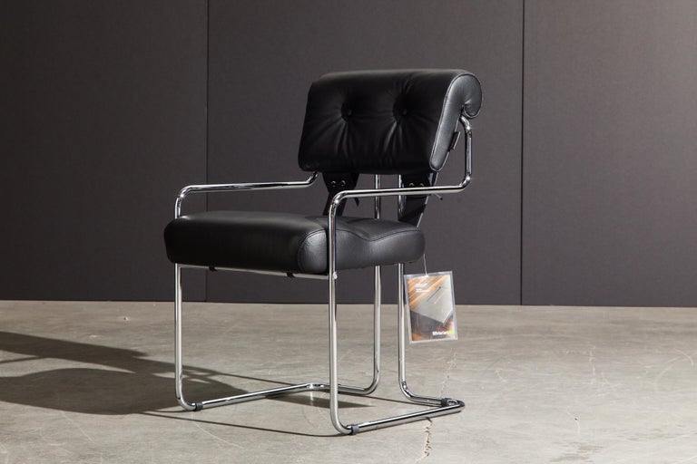 Currently, the most coveted dining chairs by interior designers are 'Tucroma' chairs by Guido Faleschini for i4 Mariani, and we have this incredible set of Tucroma armchairs in beautiful black leather with polished chrome frames. The seats and backs
