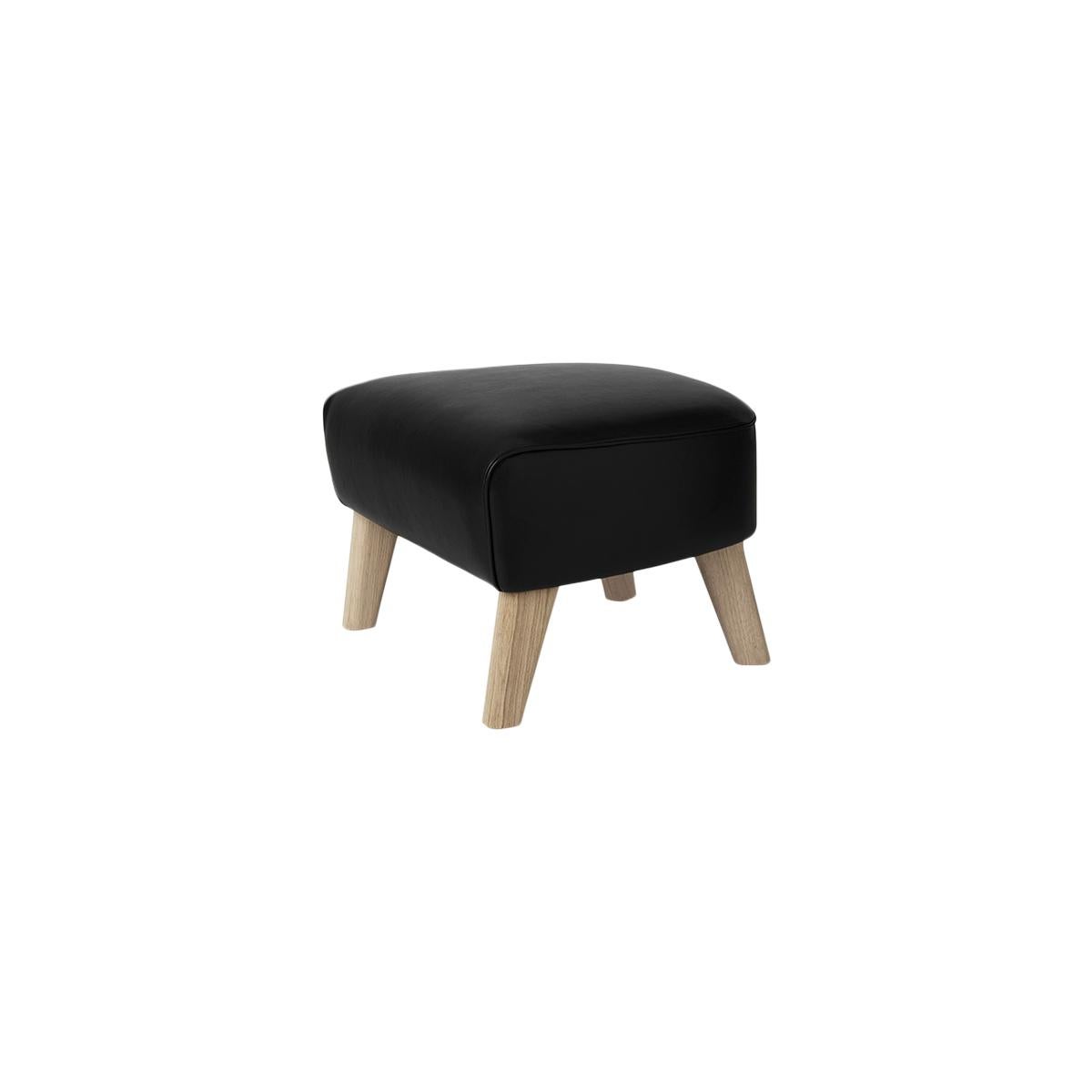 Black leather and natural oak my own chair footstool by Lassen
Dimensions: W 56 x D 58 x H 40 cm 
Materials: Leather

The my own chair footstool has been designed in the same spirit as Flemming Lassen’s original iconic chair, reflecting his love