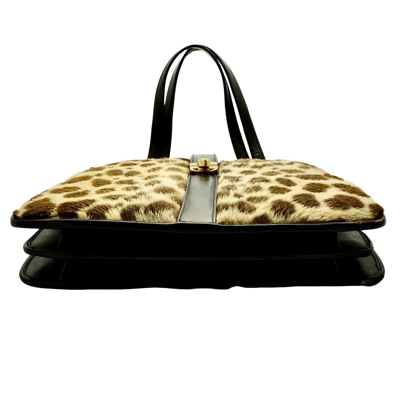 Women's or Men's Black Leather and Spotted Fur Hand Bag with Gold Plated Fittings circa 1950s For Sale
