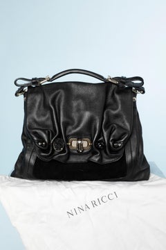 Black leather and suede shoulder bag with embellishments pieces  Nina Ricci