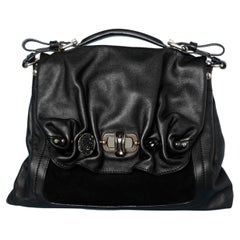 Black leather and suede shoulder bag with embellishments pieces  Nina Ricci 