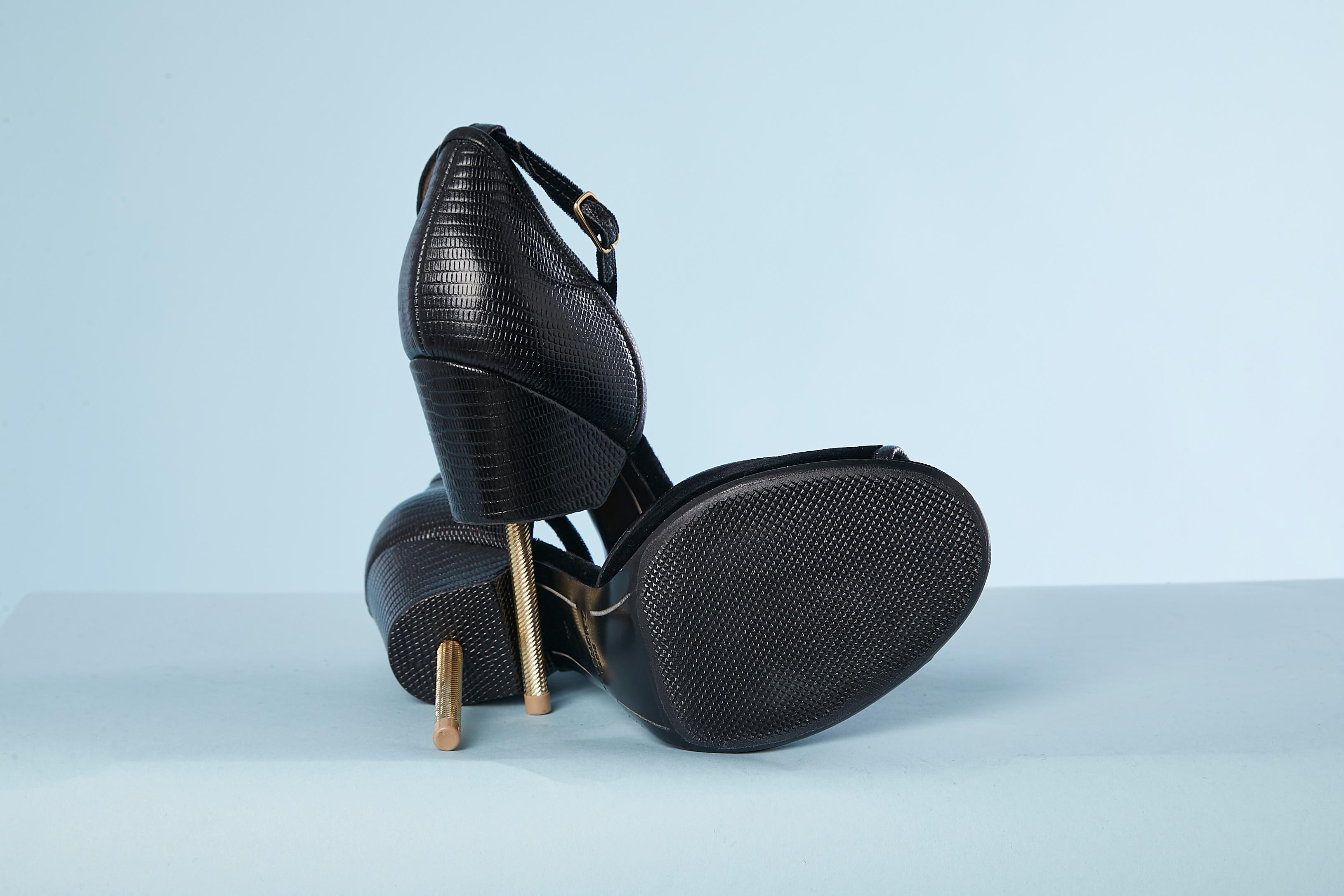 Black  leather and velvet high heel sandal with metallic screw heel.
Height of the heel= 11,5 cm
Inside platform = 1 cm
Shoe size 39 
NEW 
