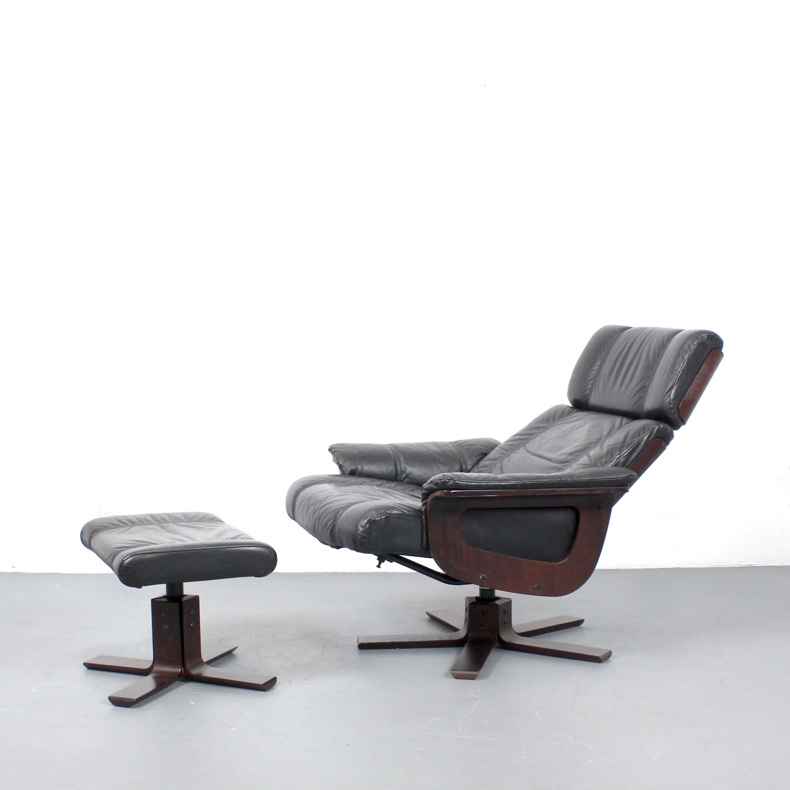 Danish Black leather and wood armchair with ottoman - Kebe - Denmark - c. 1980 For Sale