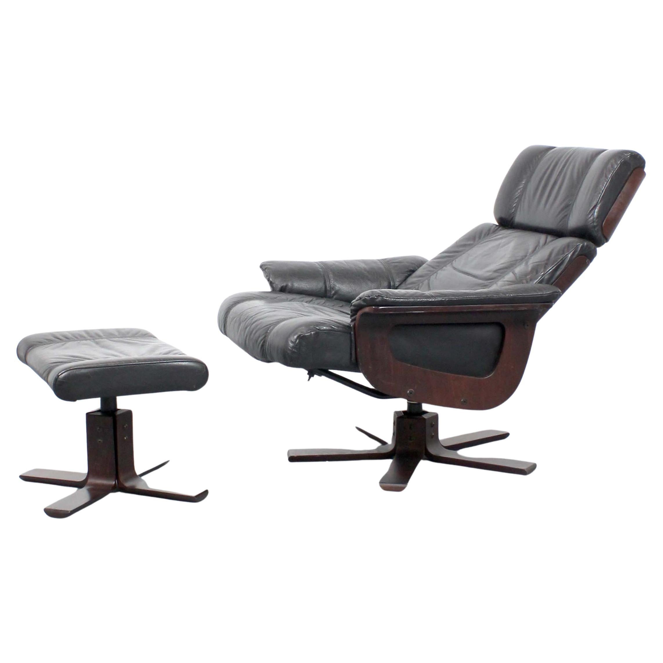 Black leather and wood armchair with ottoman - Kebe - Denmark - c. 1980 For Sale