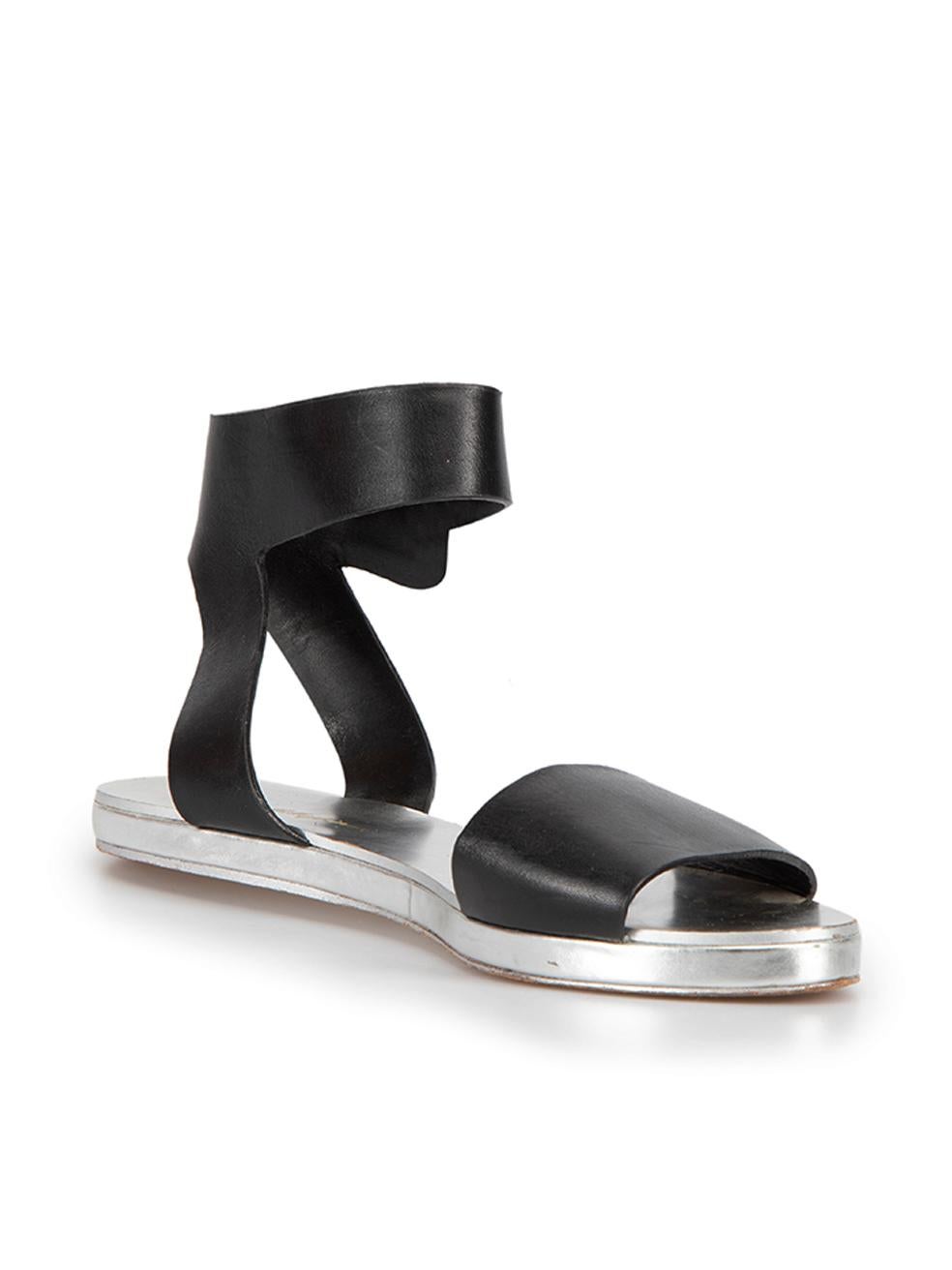 CONDITION is Very good. Minimal wear to shoes is evident. Minimal wear to both footbeds and outer sols with small scuff marks on this used 3.1 Phillip Lim designer resale item.



Details


Black

Leather

Sandals

Open toe

Flat heel

Ankle buckled