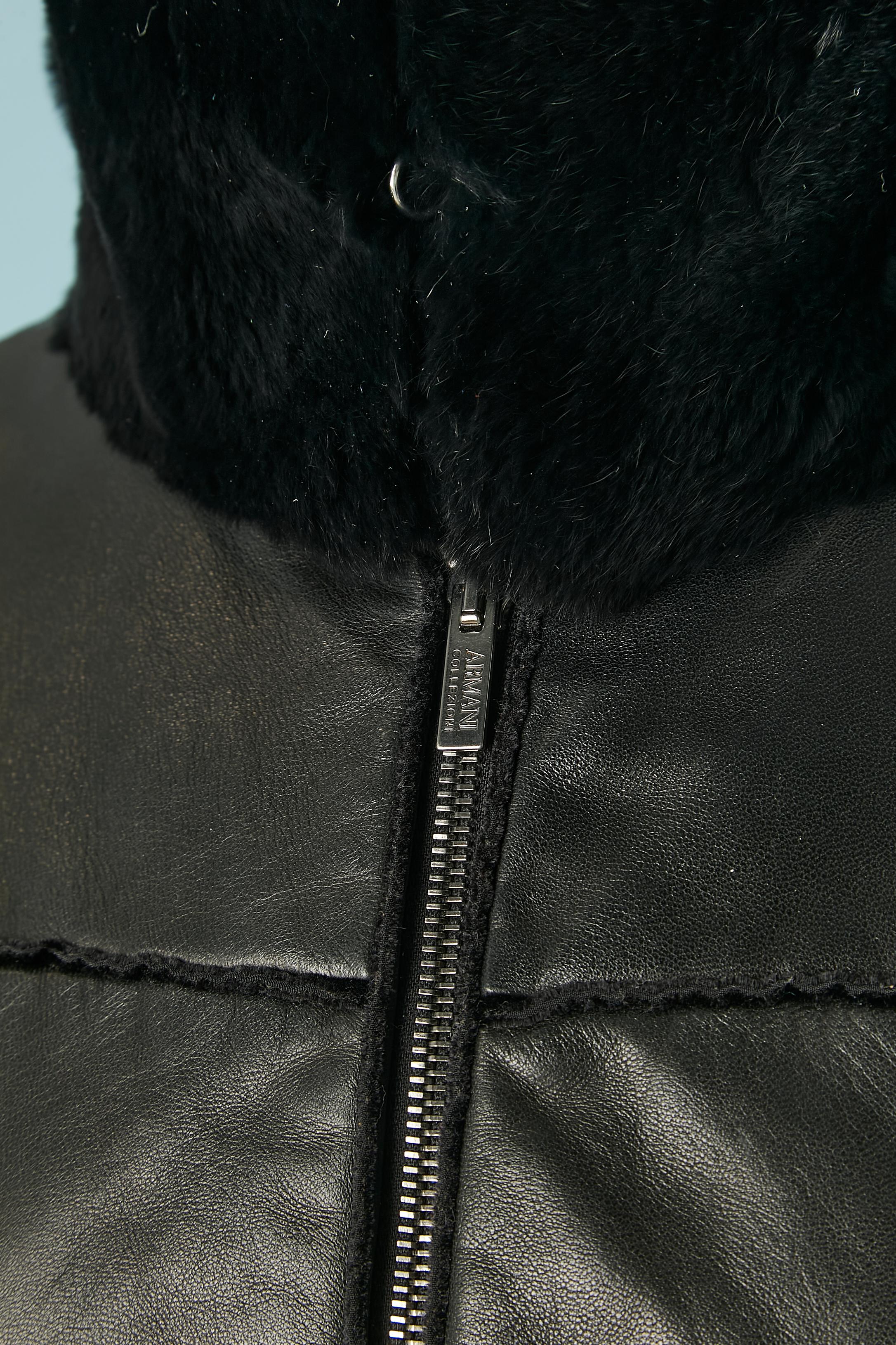 Black lamb leather anorak with fur collar. Lining: 56% rayon, 44% polyester. 
Pocket on both side with invisible zip closure. Zip closure in the middle front with branded zip puller. 
SIZE 42 (It) 38 (Fr) S/M 