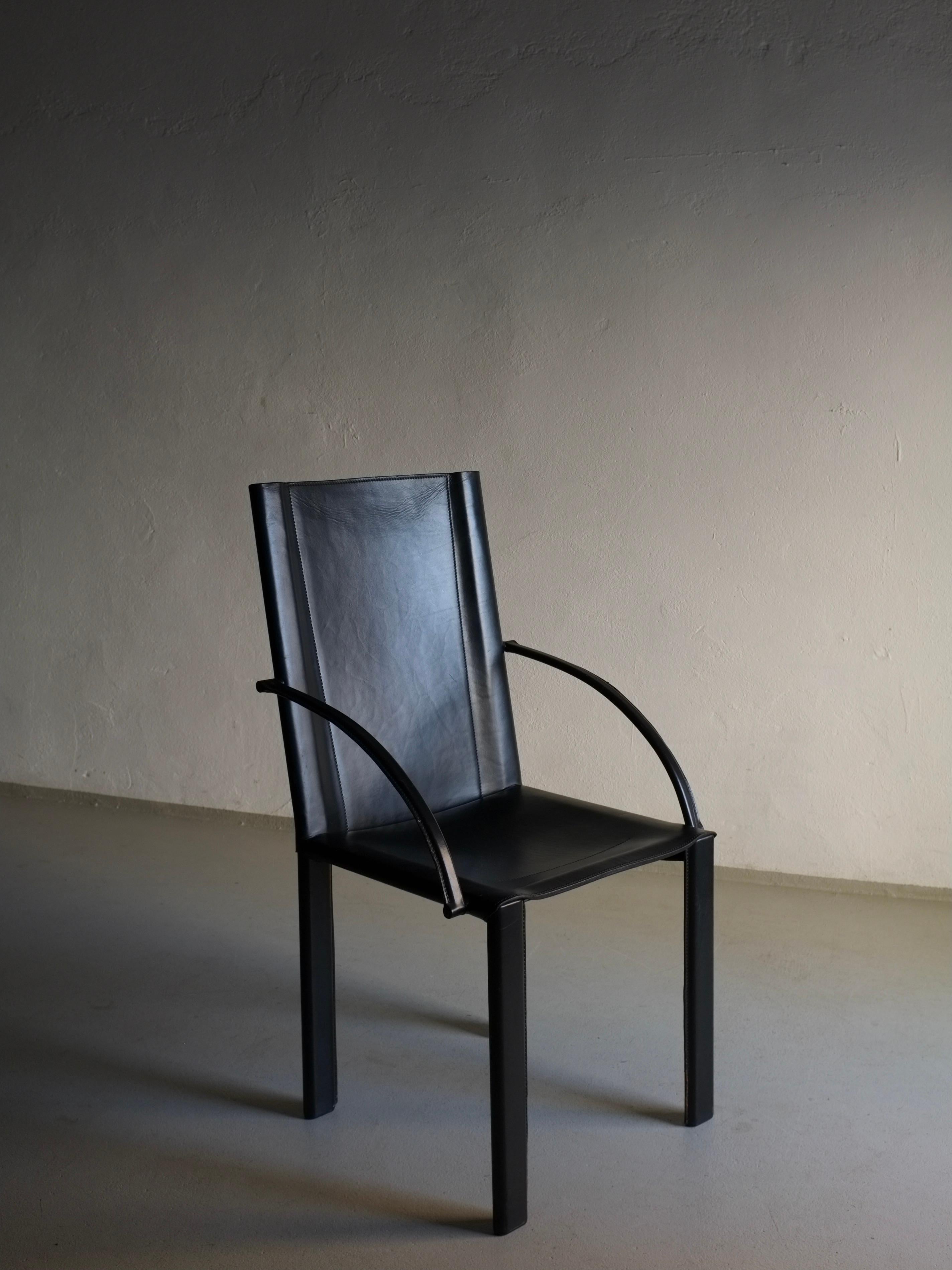 Vintage black leather armchair by Carlo Bartoli designed in the 1980s for Matteo Grassi. Very heavy because of the steel frame.

