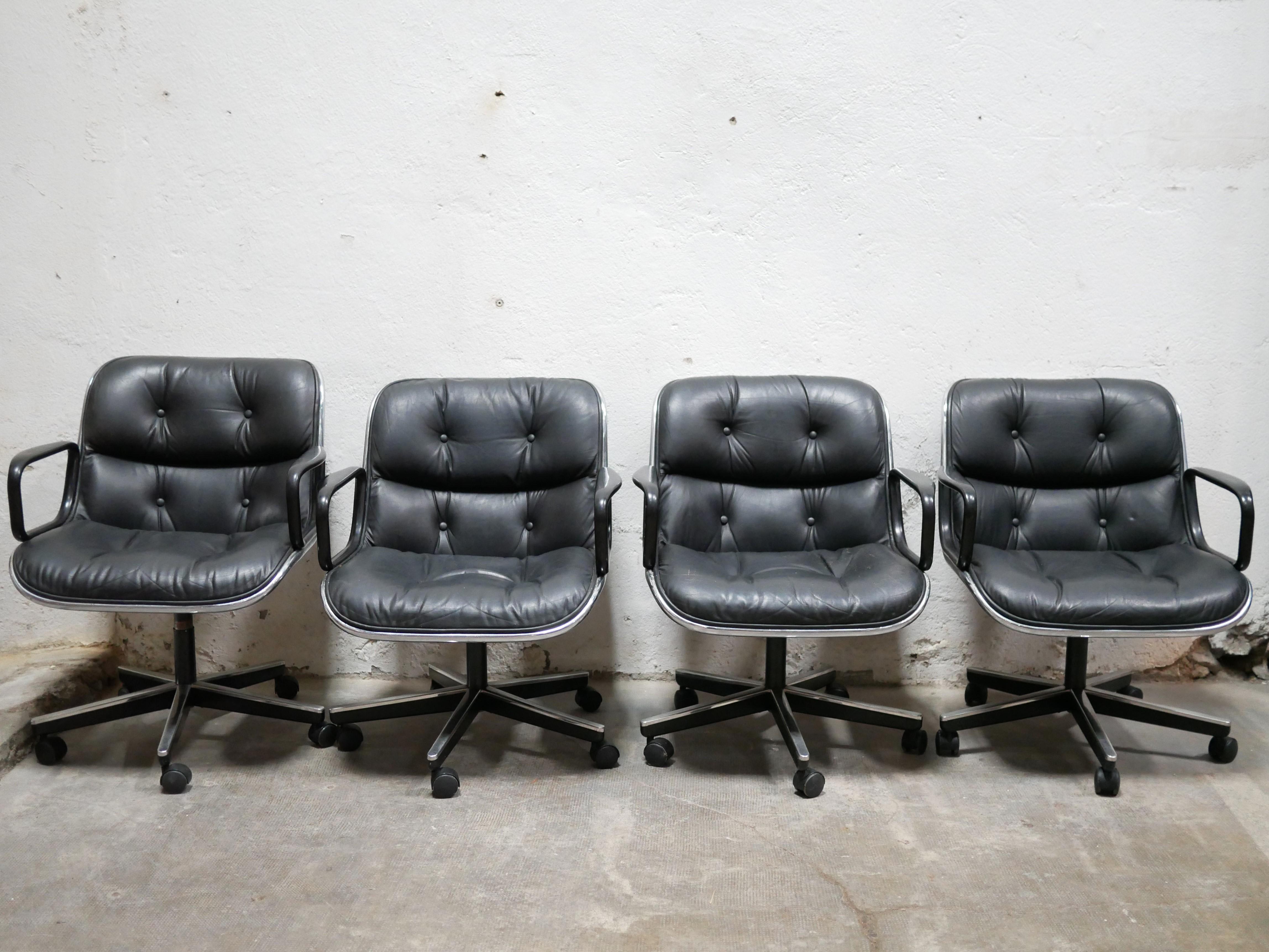 Armchair, “Executive Chair”, designed by Charles Pollock in the 1970s for Knoll International.

Black molded plastic shell with chrome contours, aluminum star base, comfortable, ergonomic and very soft seat covered in soft black leather.
The chair
