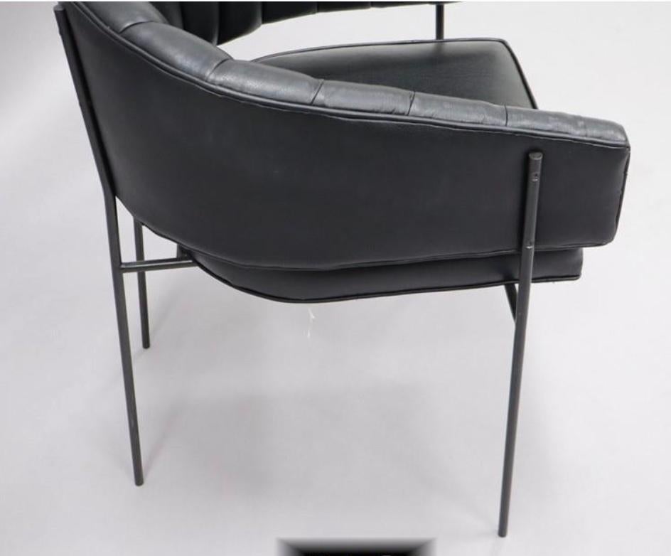 Black leather armchair with long channel tufting in the style of Jacques Adnet